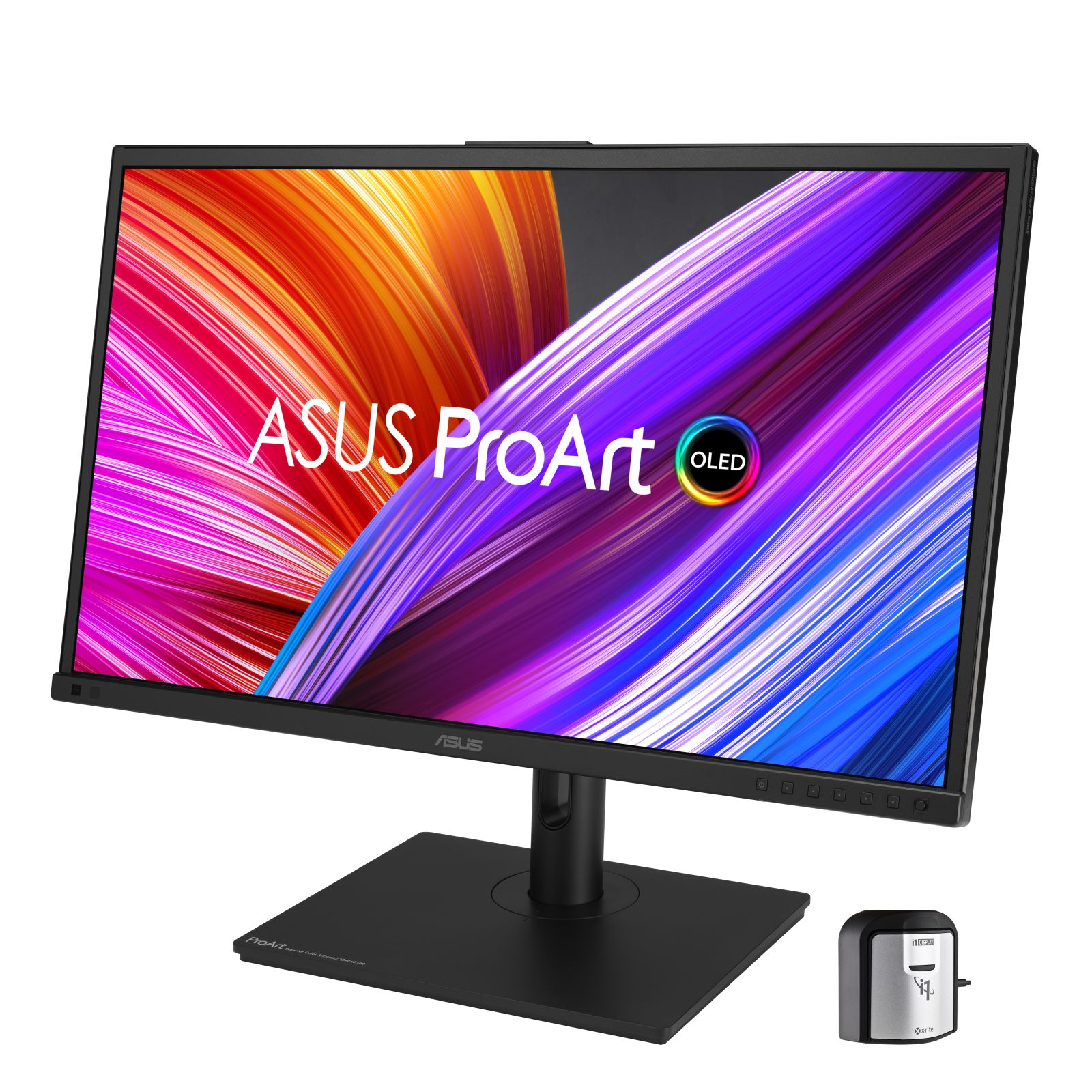 Czarny monitor komputerowy z logo ASUS ProArt i małym srebrnym urządzeniem na białym tle.