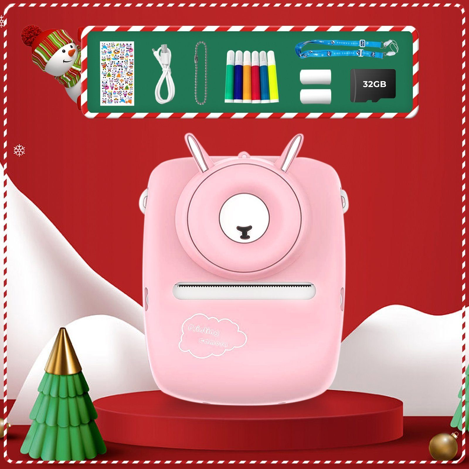 Un kit de cámara rosa con una cinta, marcadores, baterías, una tarjeta SD y una caja de regalo sobre un fondo rojo y verde.