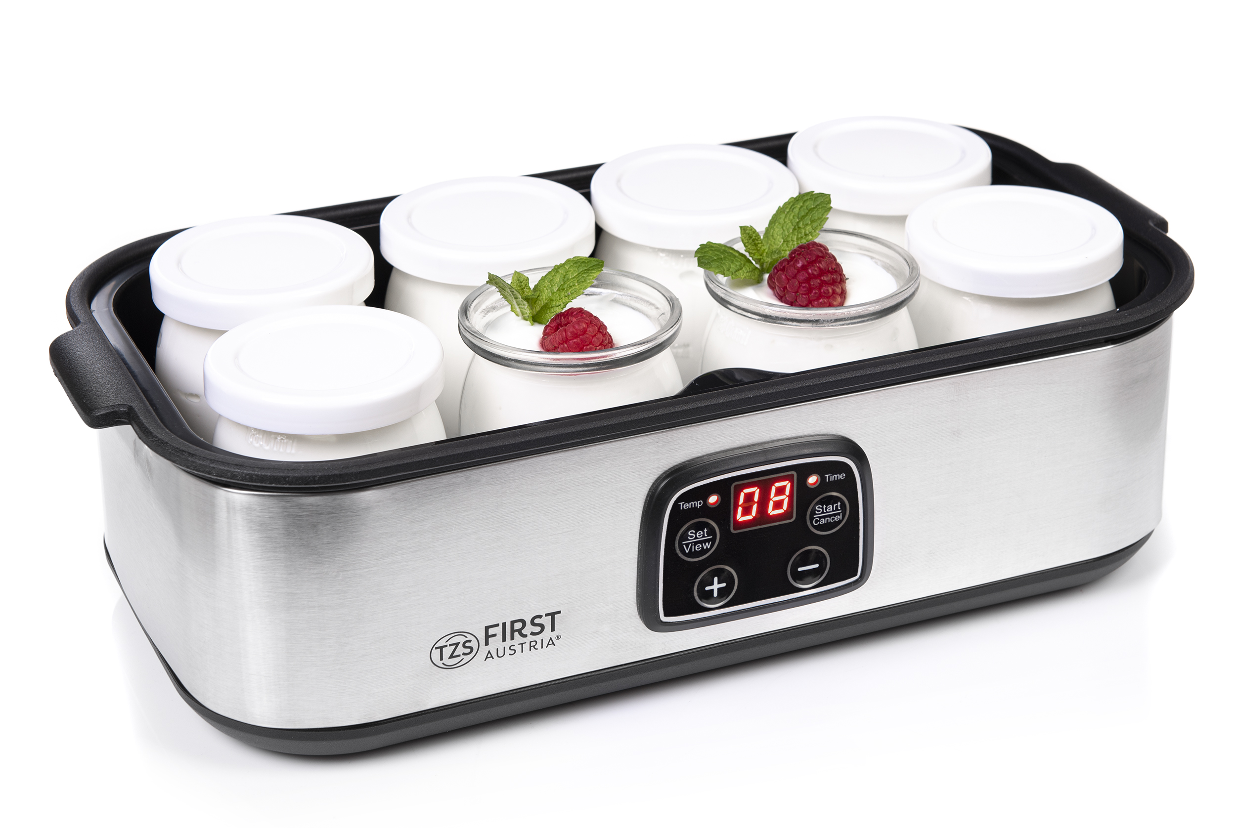 Ein Joghurtbereiter aus Edelstahl mit sechs Gläsern gefüllt mit Joghurt, garniert mit Himbeeren und Minze.