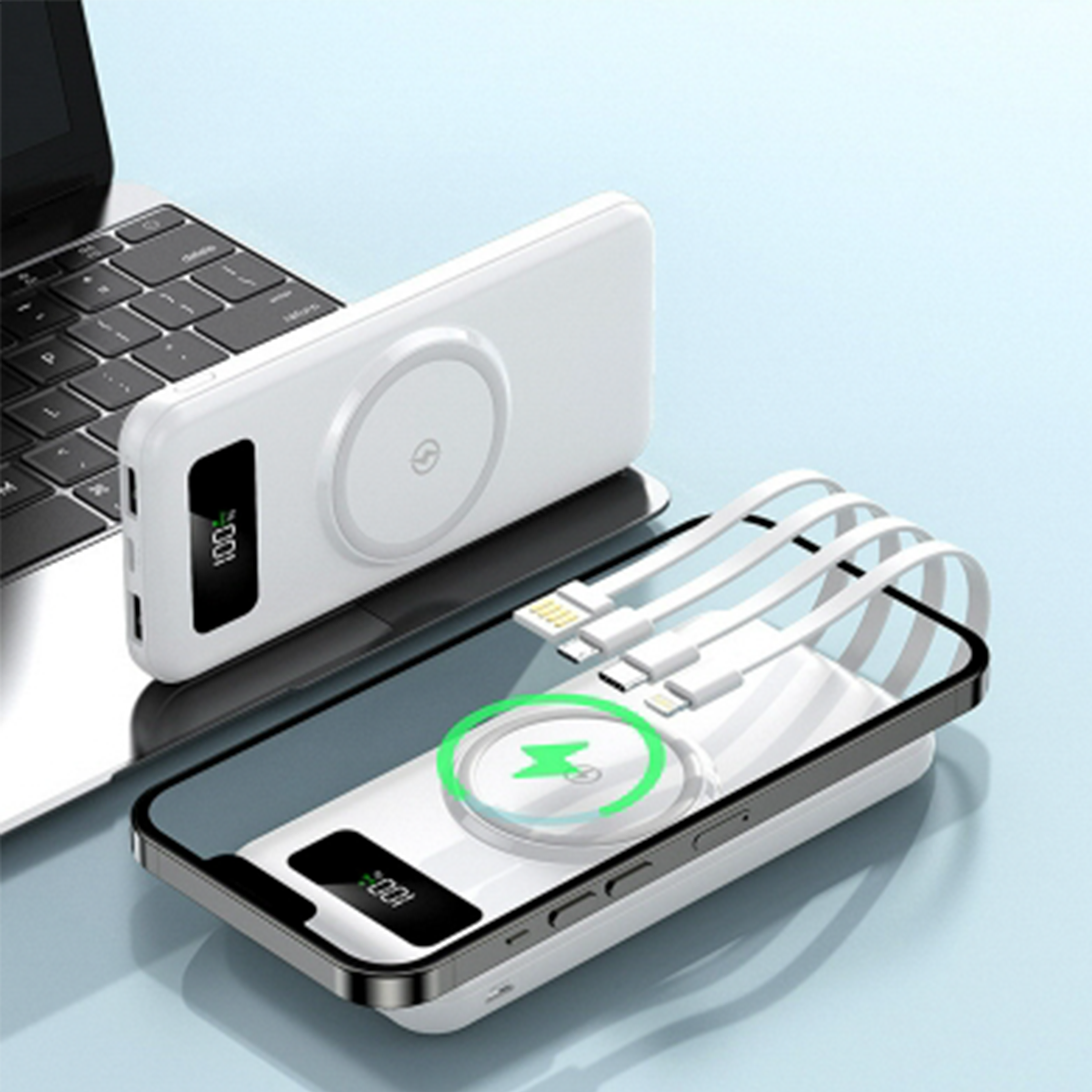 Weiße Powerbank mit Ladepad, verbunden mit einem Telefon und einer anderen Powerbank auf einem Laptop.