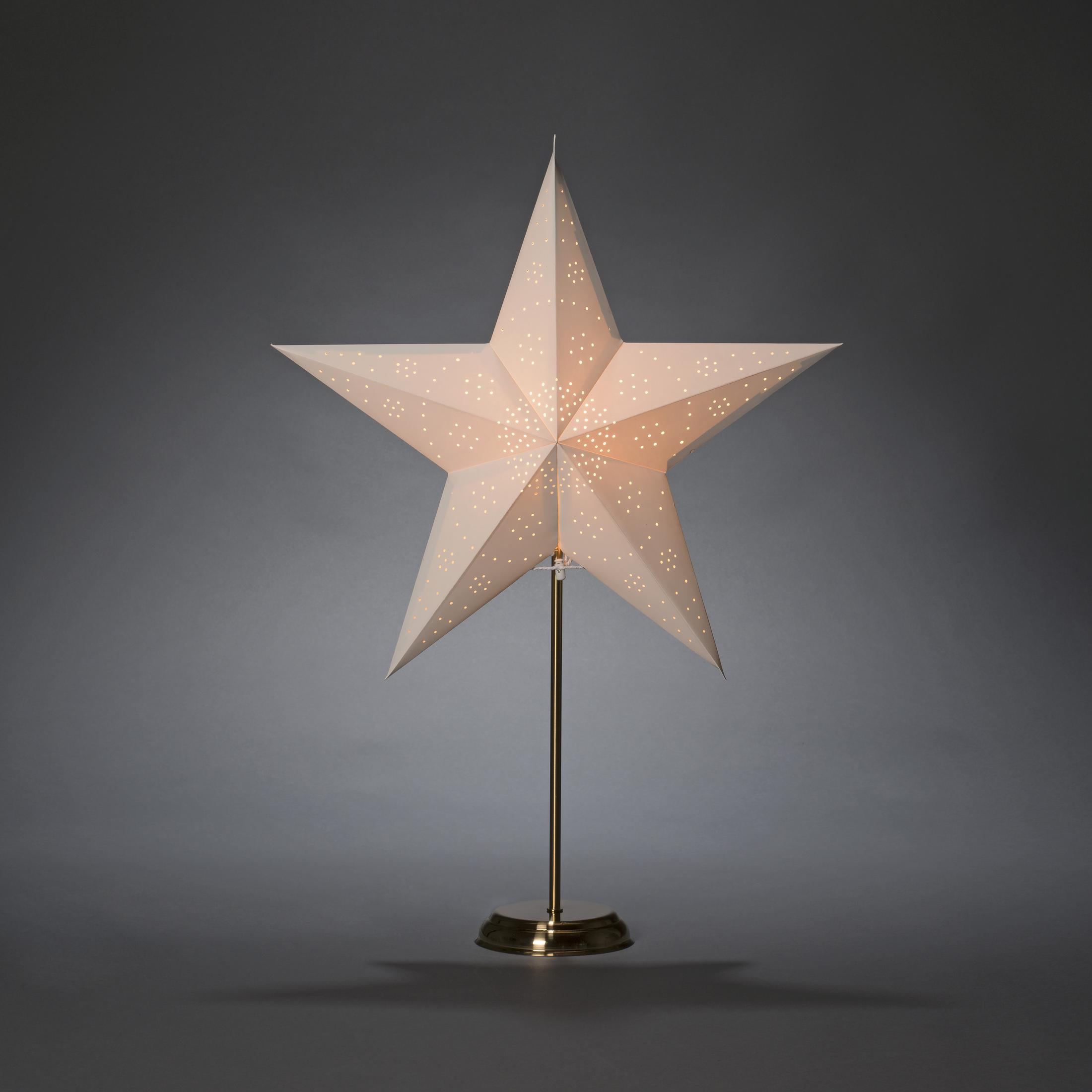 Lampada a stella illuminata su un supporto, con un design a stella di carta bianca.