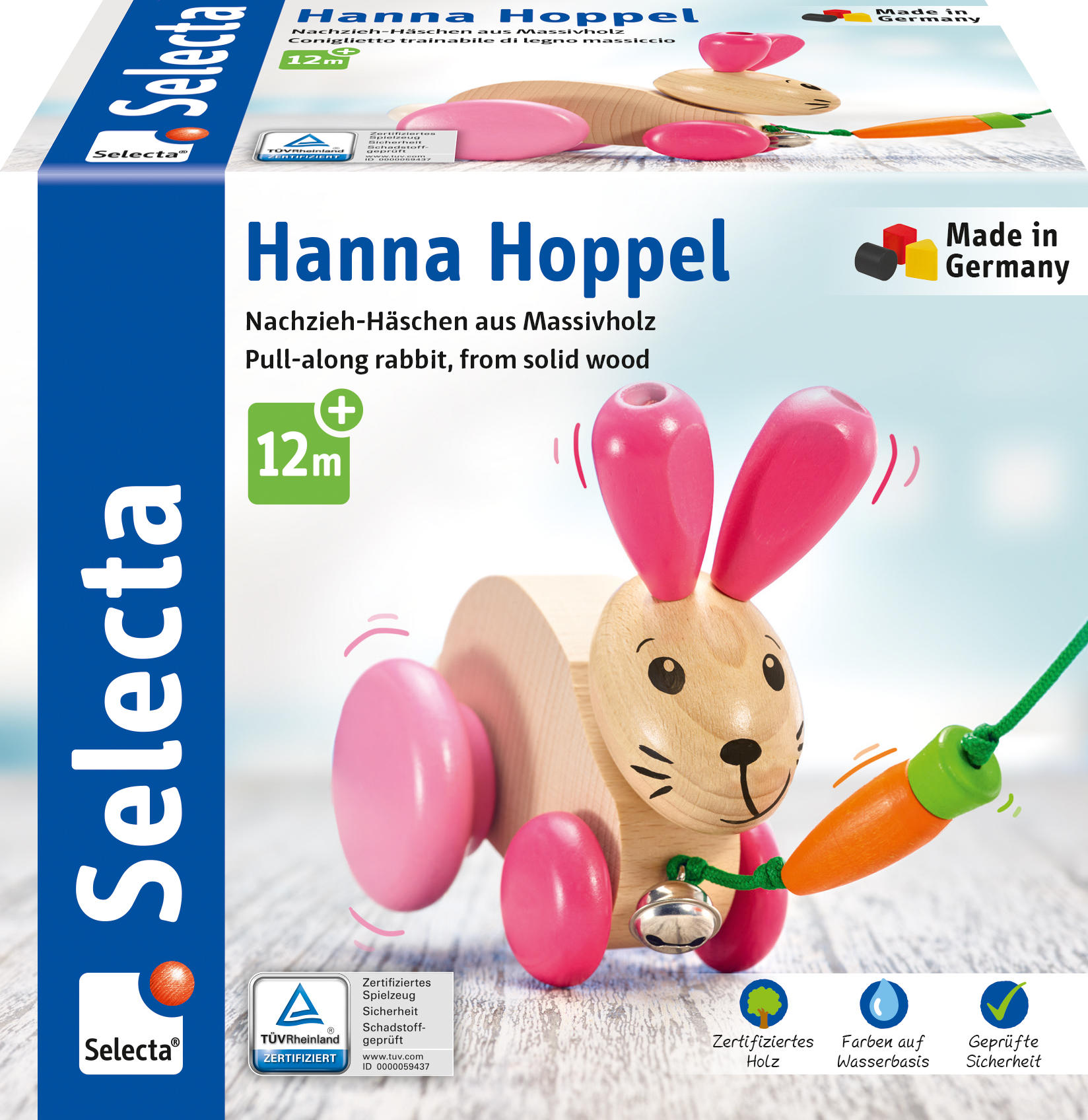 Holz-Nachziehkaninchen mit rosa Ohren und Karotte. Auf der Schachtel steht 'Hanna Hoppel' und 'Made in Germany'.