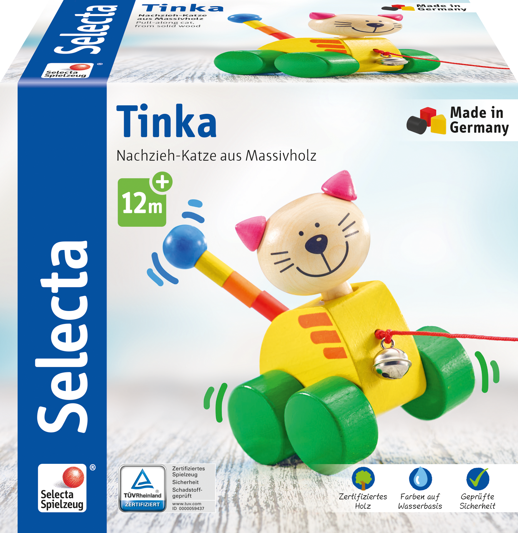 Schachtel eines hölzernen Nachziehtiers, Katze. Das Spielzeug hat einen gelben Körper und einen rosa Kopf.