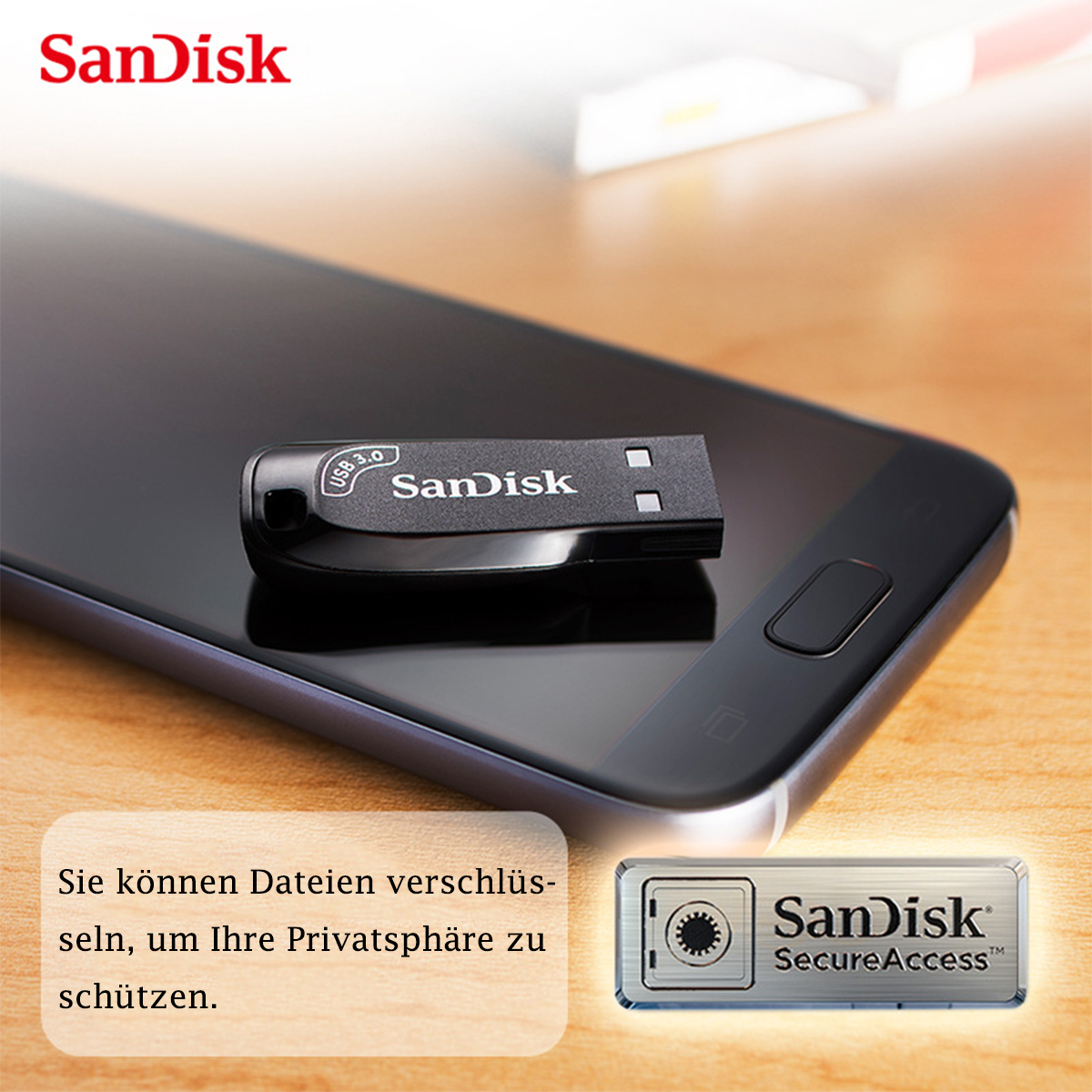 Ein schwarzer Sandisk USB-Stick auf einem Telefon mit einem Bild eines Safes.