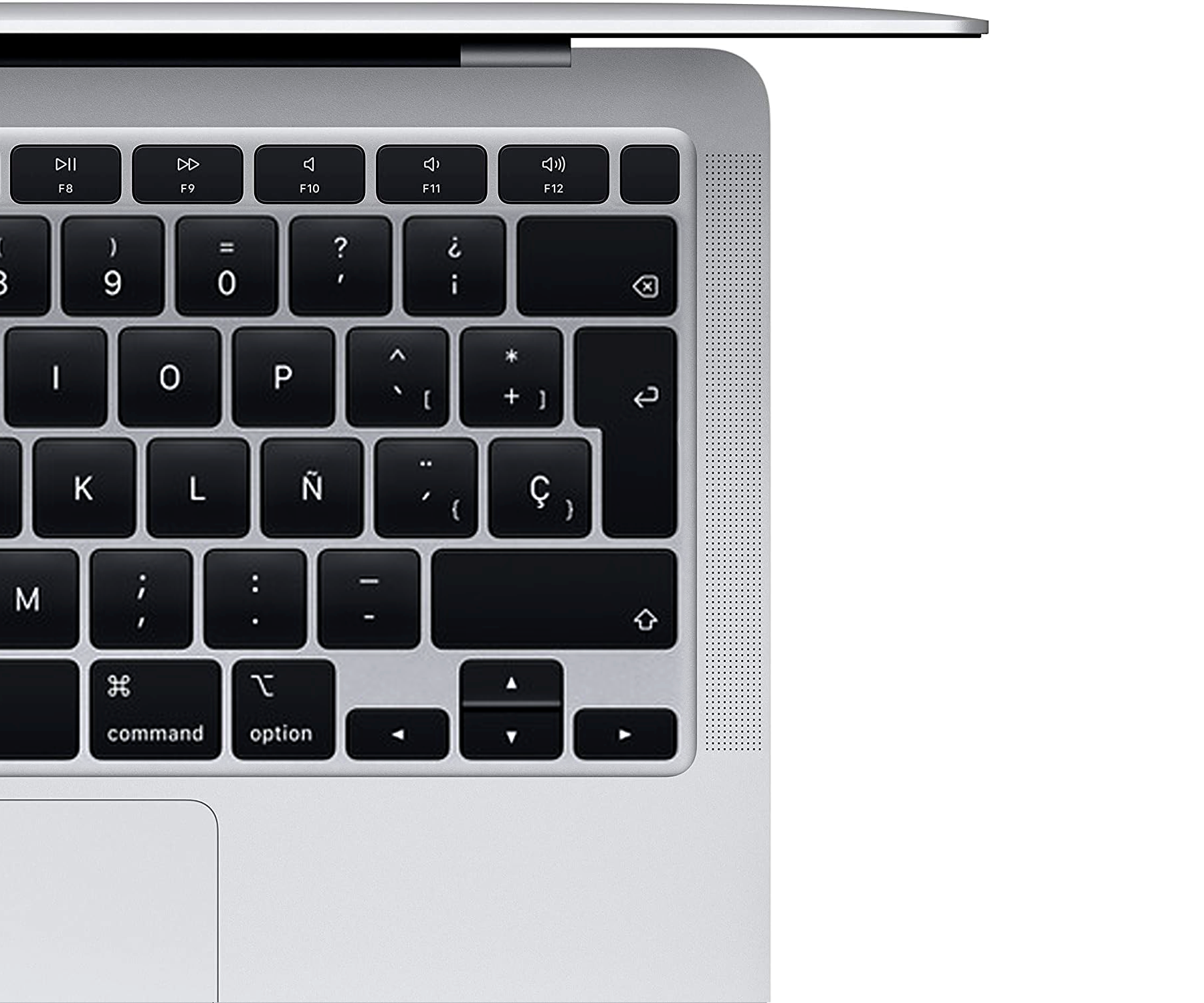 Primer plano de un teclado de portátil, con la esquina superior derecha visible. Teclas negras y marco plateado.