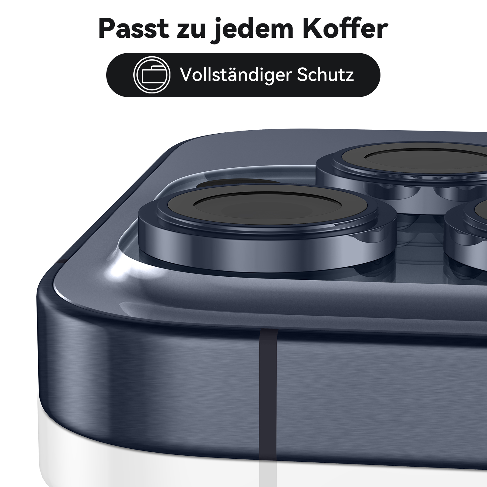 Nahaufnahme eines dunkelblauen Telefons mit drei schwarzen Kreisen auf der Rückseite, Text: 'Passt zu jedem Koffer'.