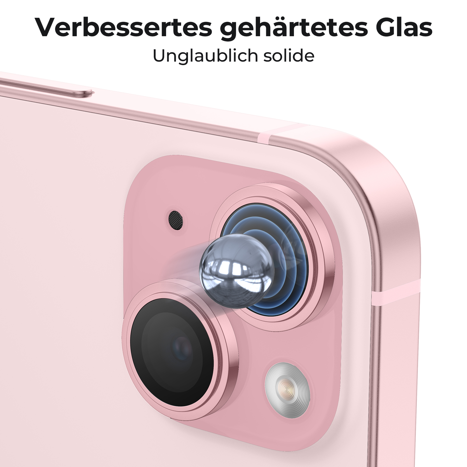 Nahaufnahme einer rosa Telefonkamera-Linse mit einer silbernen Kugel. Hintergrund ist ein rosa Telefon.