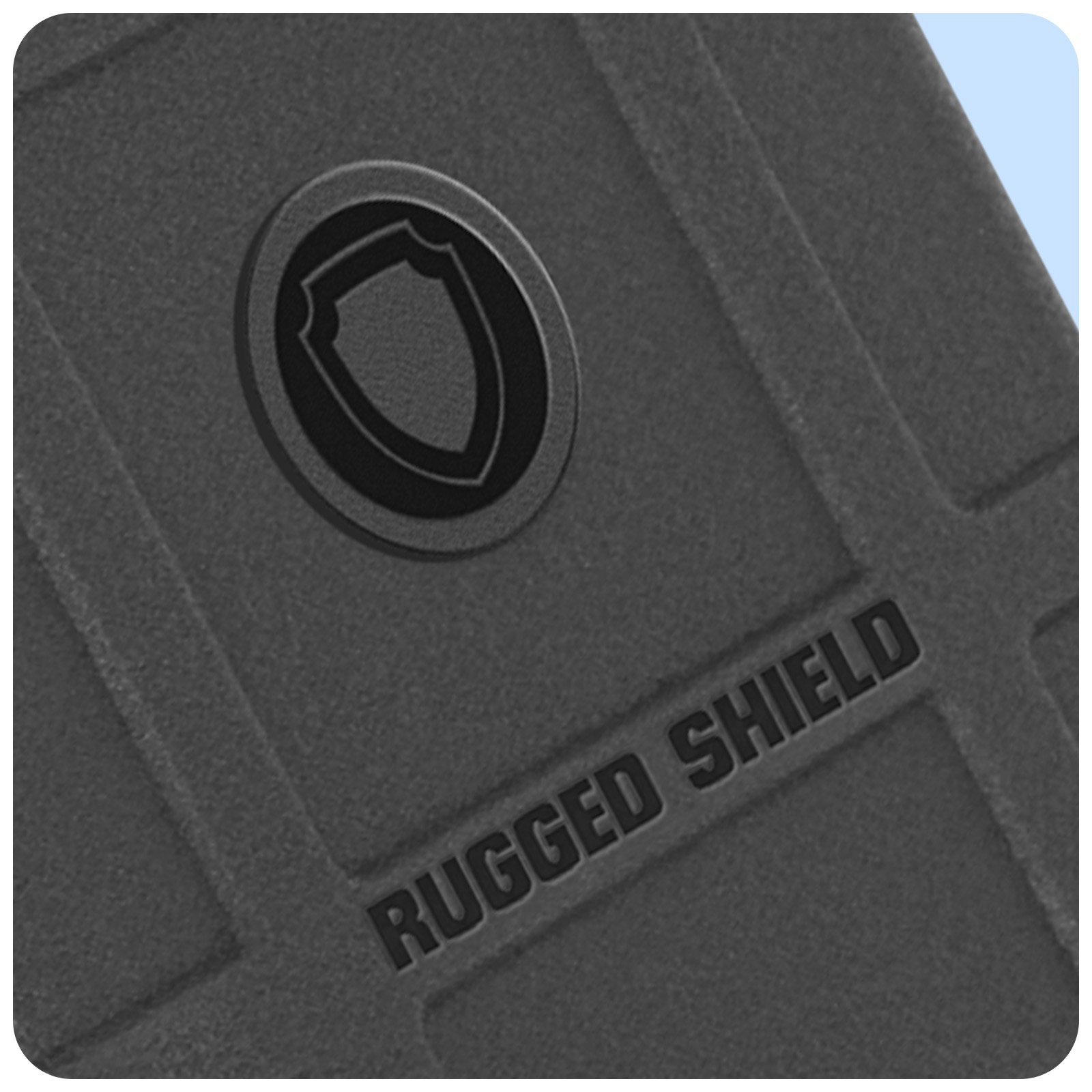 Primo piano di una superficie grigia strutturata con le parole 'RUGGED SHIELD'.