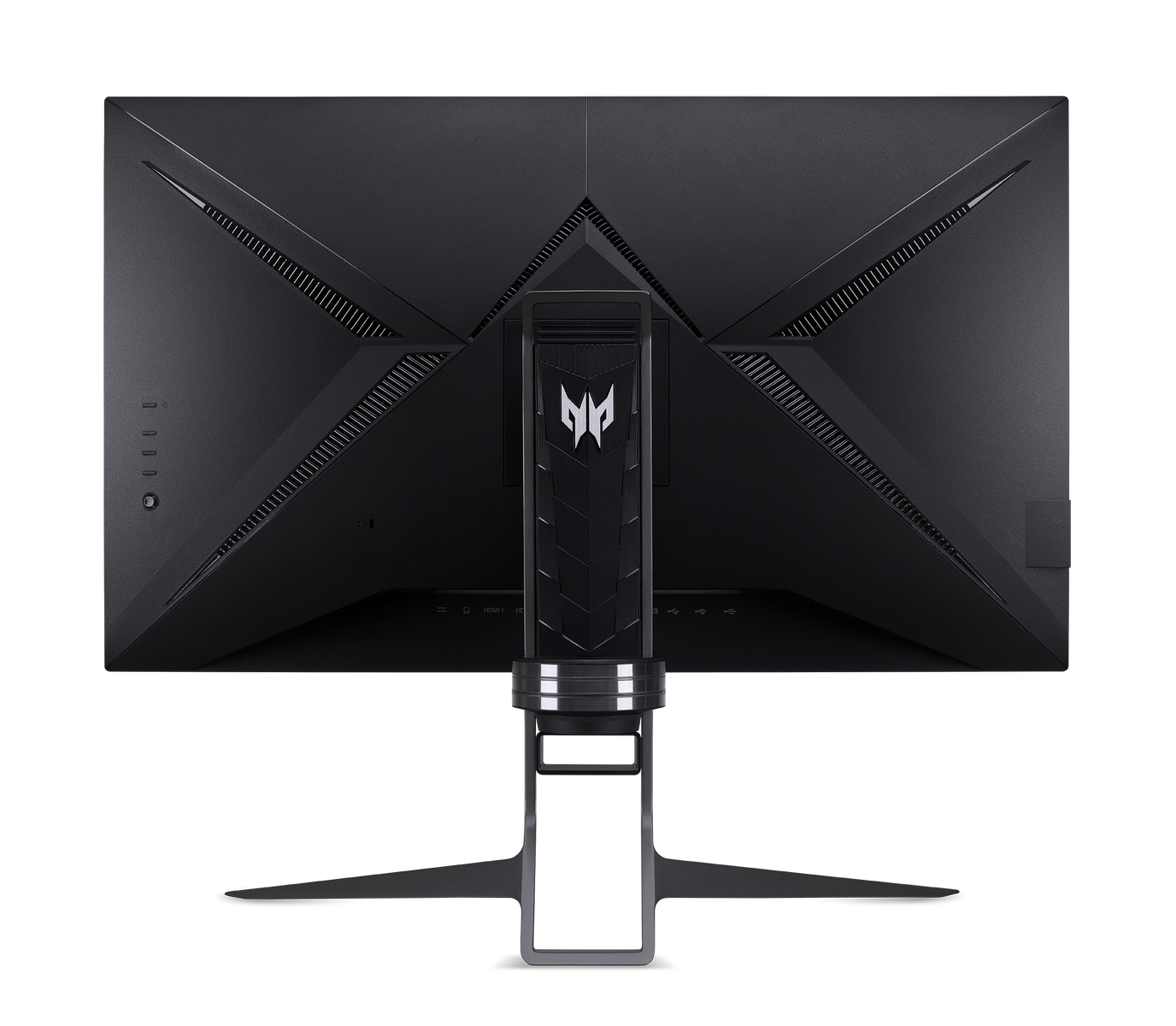 De achterkant van een zwarte gaming monitor met een standaard en meerdere poorten, op een zwarte achtergrond.