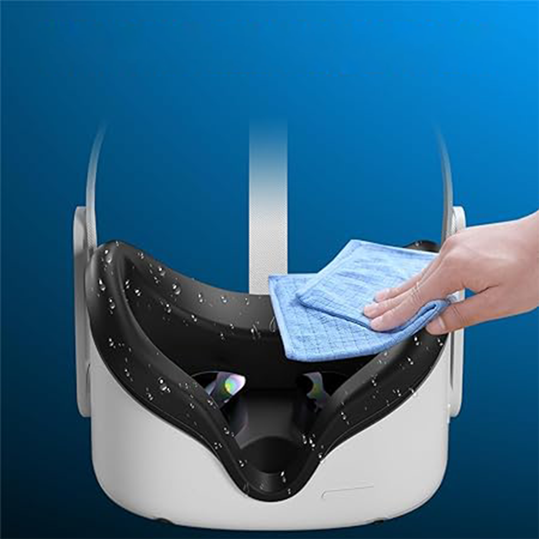 VR-Headset wird mit einem blauen Tuch gereinigt. Wassertropfen sichtbar.
