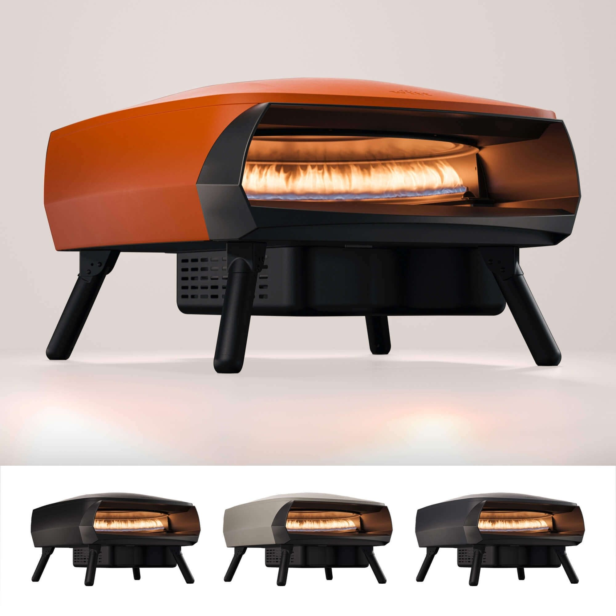 Un forno per pizza arancione e nero con interno illuminato, su una superficie bianca.
