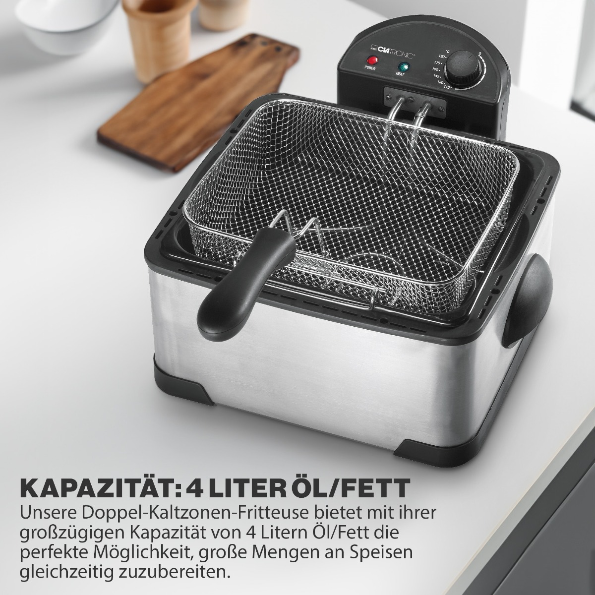 Frytownica ze stali nierdzewnej z koszem w środku, stojąca na blacie z tekstem poniżej.