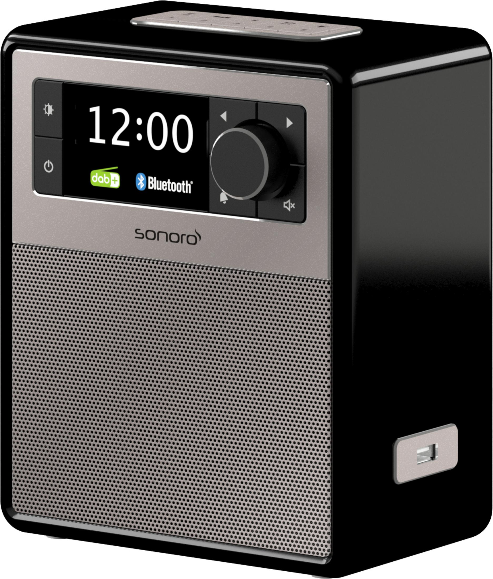 Ein schwarzes und silbernes Digitalradio mit Display, das 12:00 Uhr und Bluetooth anzeigt.