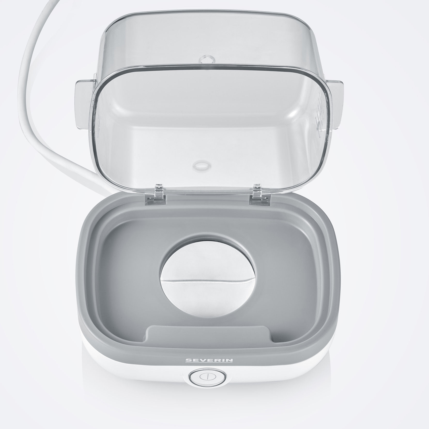 Otwarta, przezroczysta plastikowa parownica do żywności z białą i szarą podstawą, kabel po lewej.