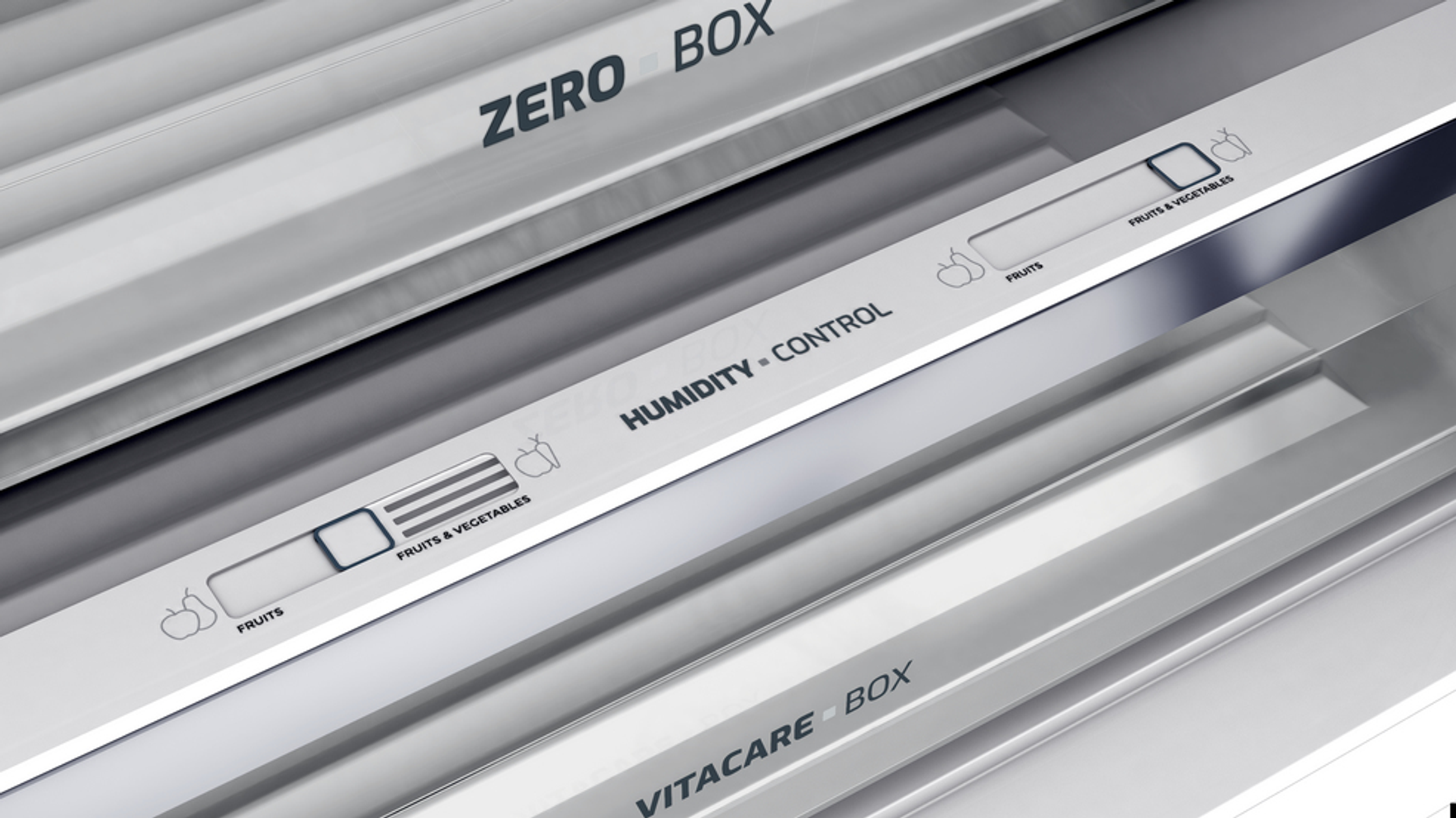 Primer plano de los compartimentos del refrigerador. Las etiquetas dicen "ZERO BOX", "HUMIDITY CONTROL" y "VITACARE BOX".