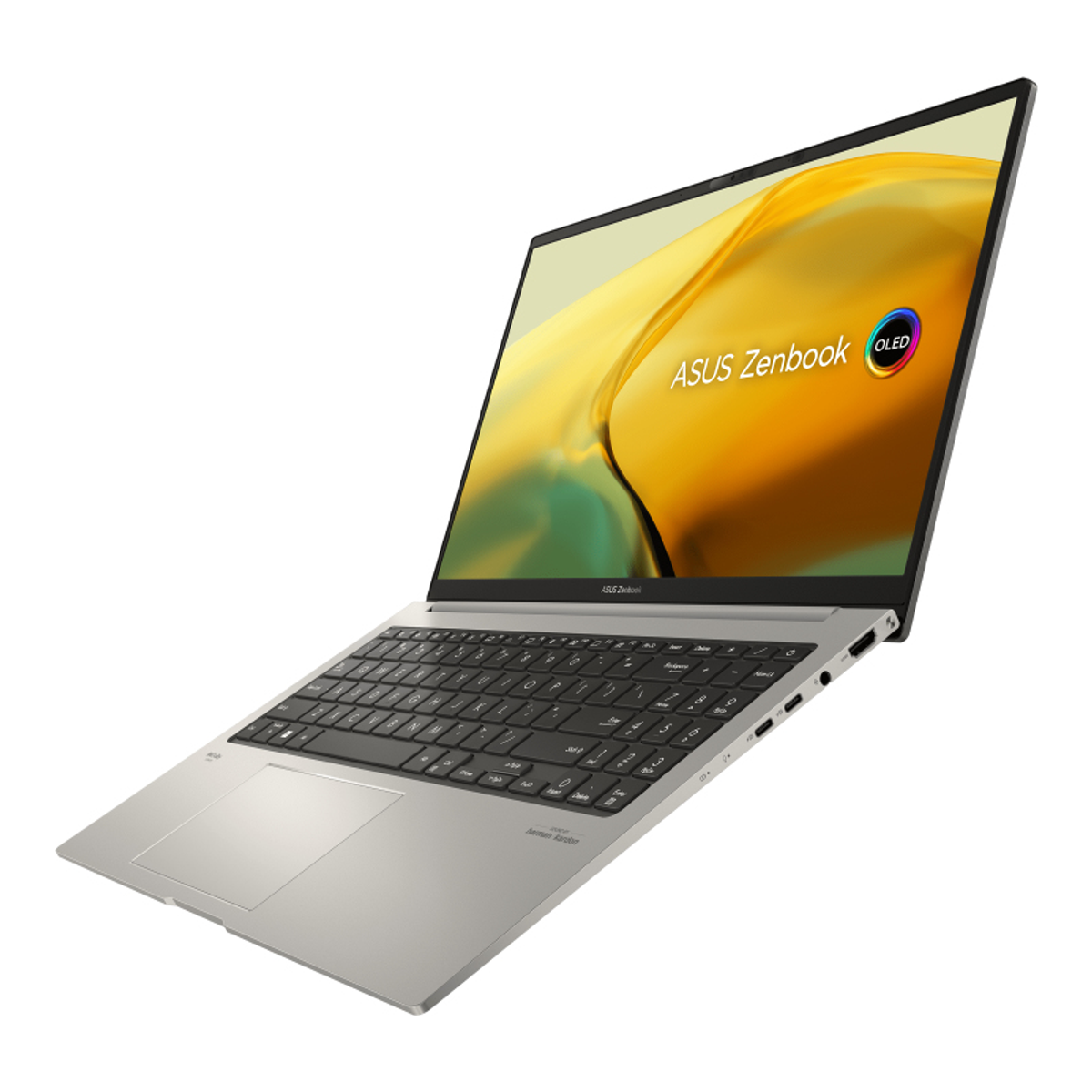 Ordenador portátil plateado con la pantalla abierta. La pantalla muestra una imagen colorida y el logotipo de ASUS Zenbook.