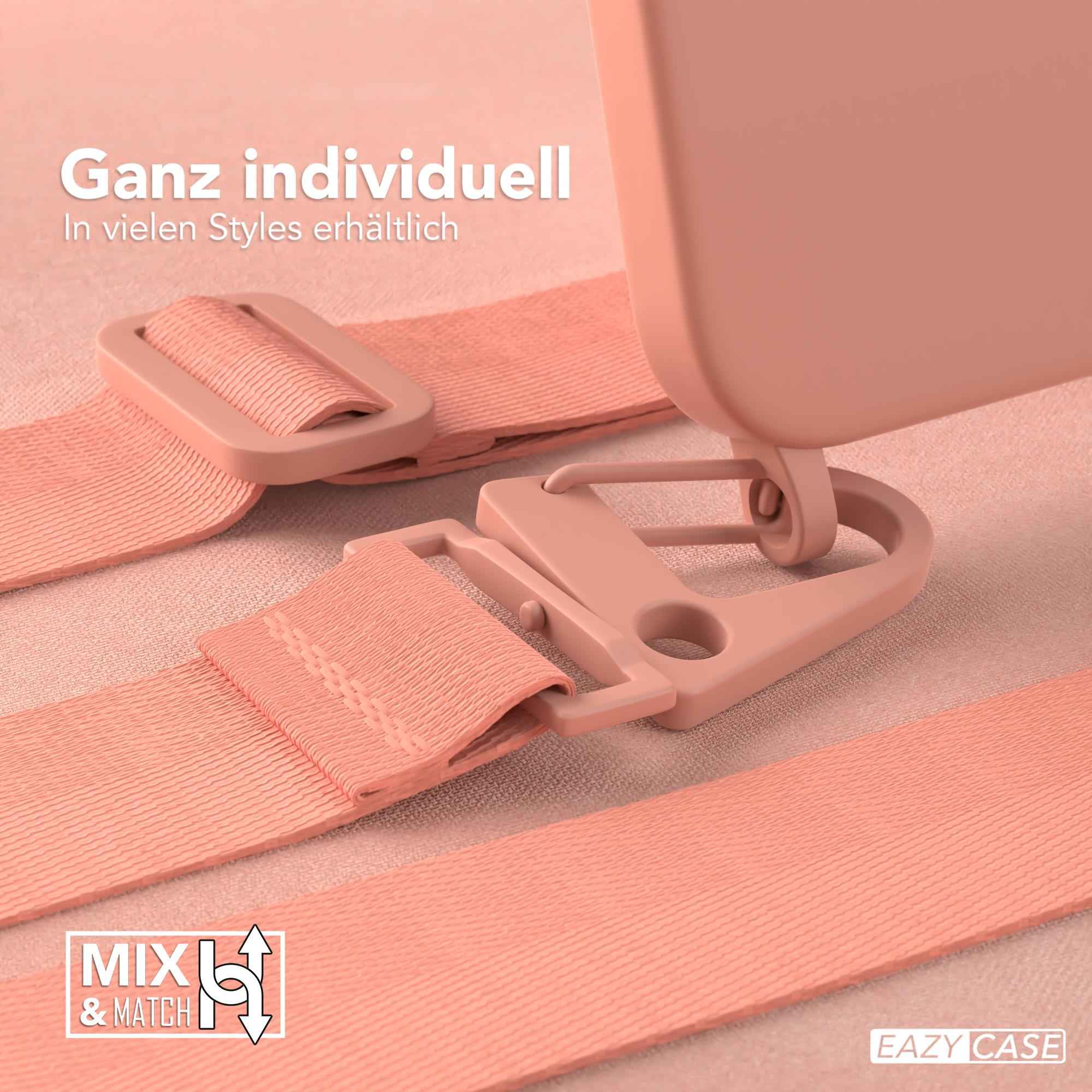 Nahaufnahme einer rosa Handyhülle mit Riemen und Schnallen, Text auf Deutsch.
