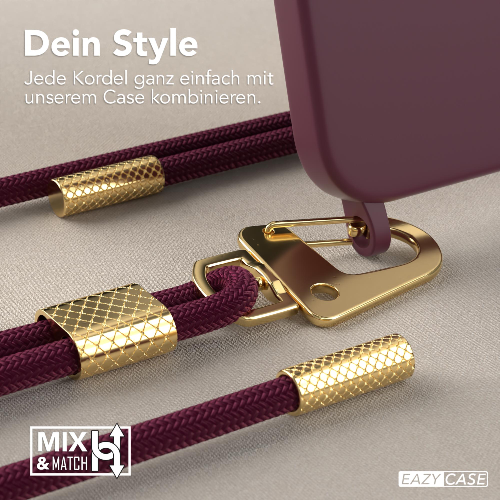Nahaufnahme von Handyhüllen-Zubehör mit einem lila Kabel und goldenen Verschlüssen sowie einer goldenen Handyhülle.