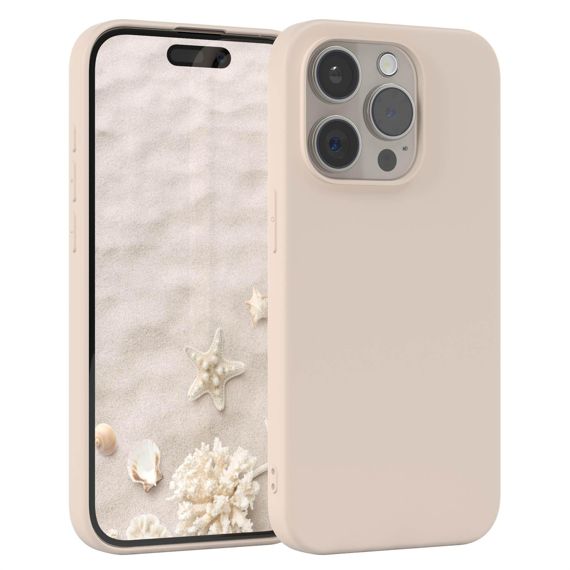 Telefon in beigefarbenem Gehäuse mit Strandmotiv auf dem Bildschirm. Weißer Hintergrund.