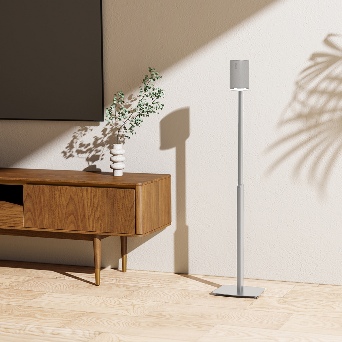 Modernes Wohnzimmer mit Soundbar, Fernseher und Holzschrank mit Dekoration.