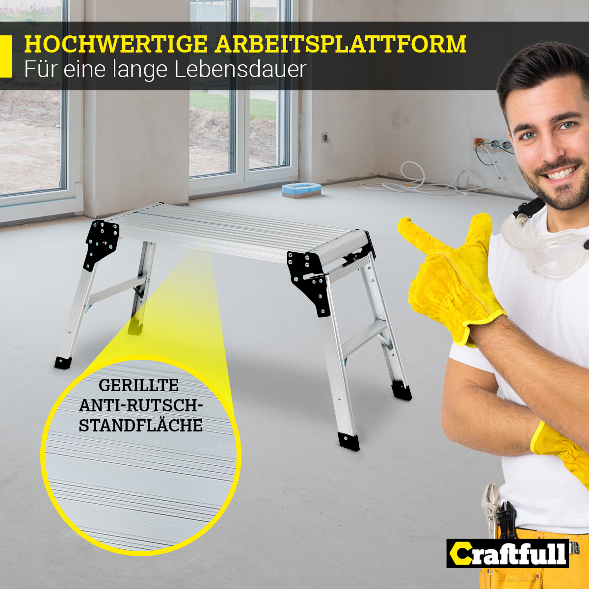 Silberne Arbeitsplattform mit schwarzen Akzenten. Mann mit Handschuhen zeigt auf die Plattform.