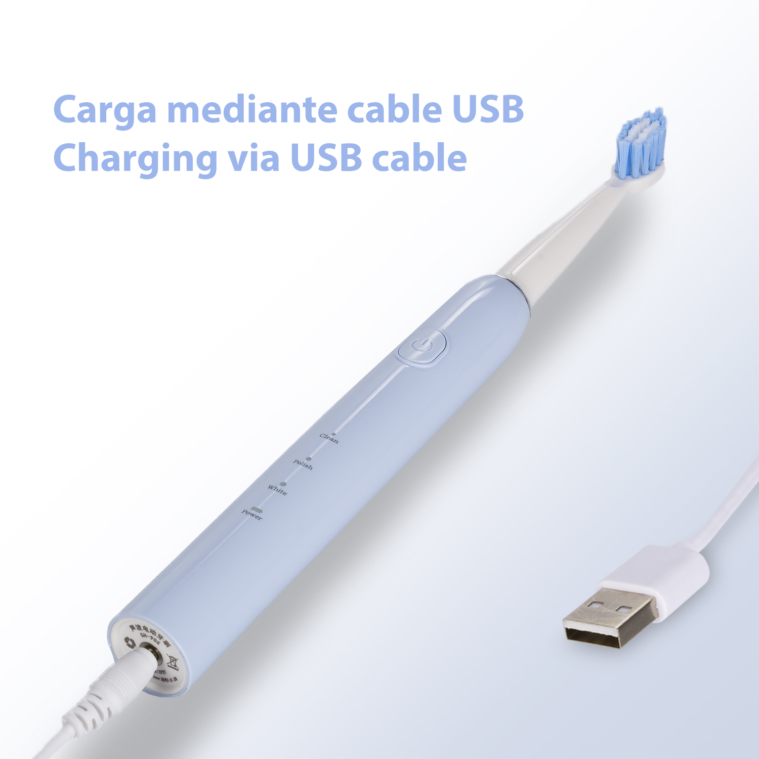 Cepillo de dientes eléctrico azul y blanco con un cable de carga USB conectado.