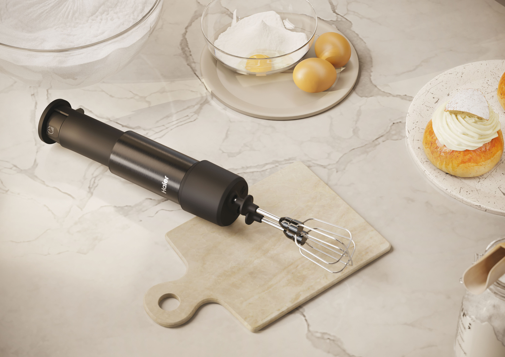 Black hand blender with a whisk attachment, resting on a wooden cutting board. A marble countertop.