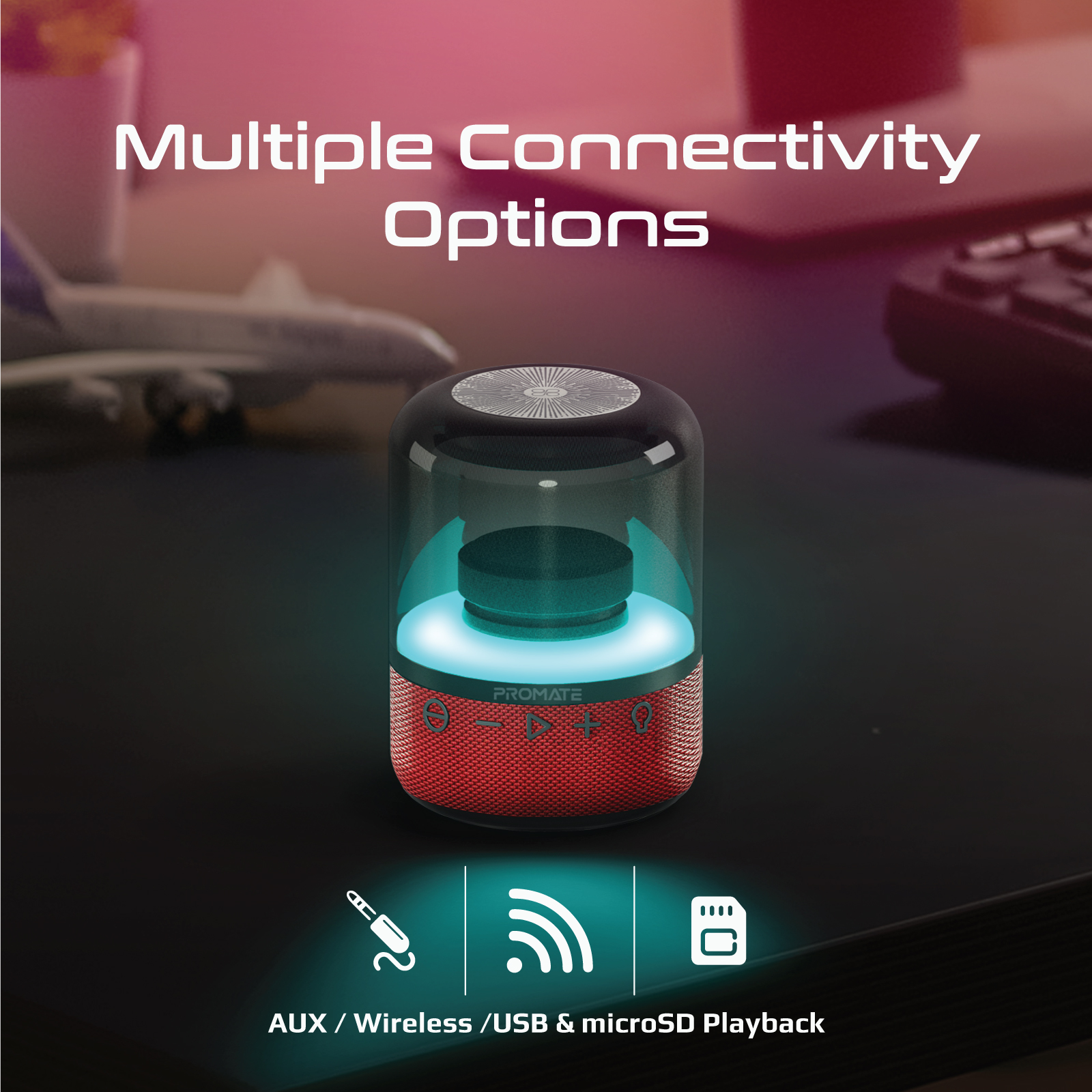 Altavoz con múltiples opciones de conectividad. Cuerpo rojo con tapa negra. Inalámbrico y USB.