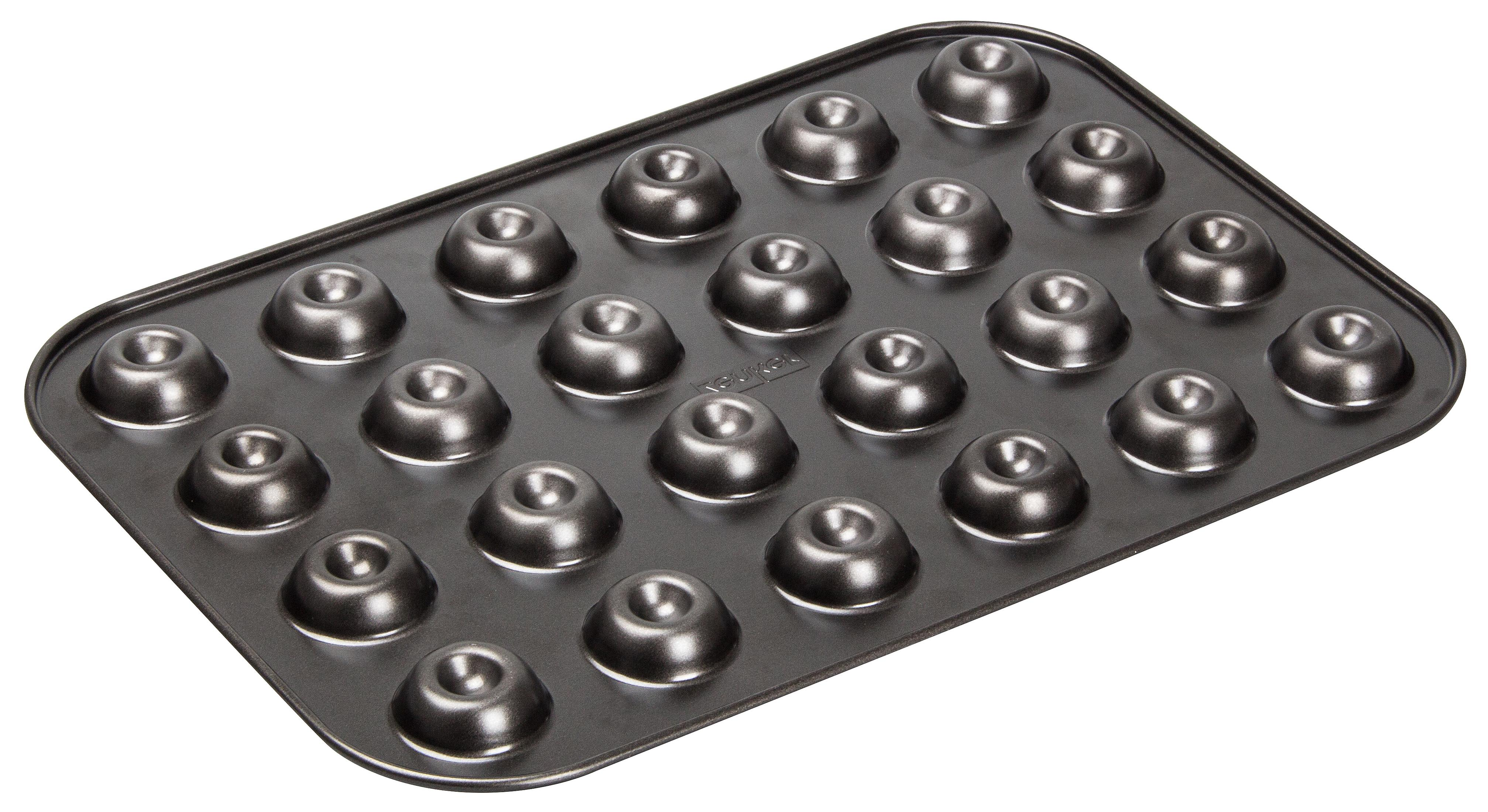 Schwarzes Backblech mit 24 donut-förmigen Vertiefungen.
