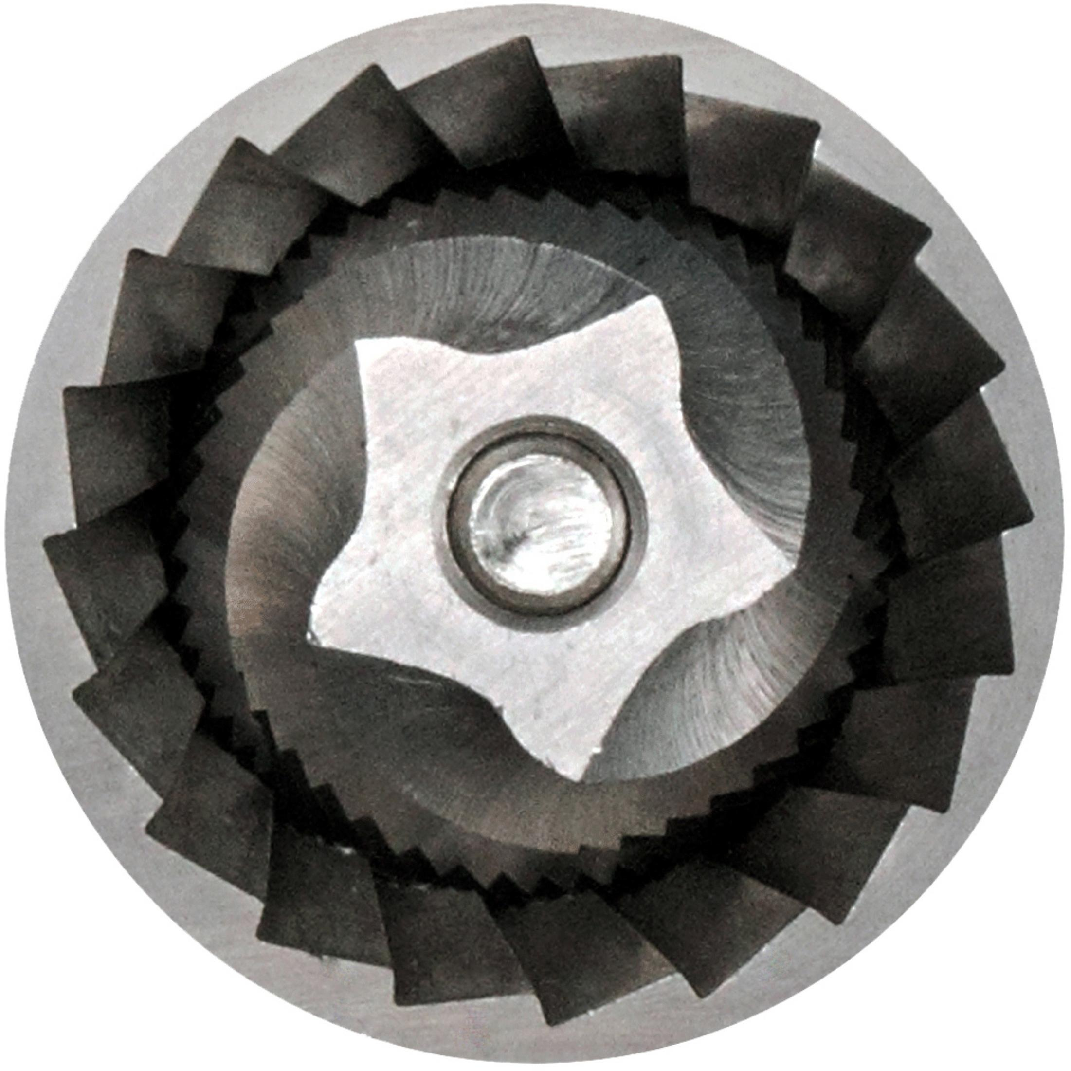 Nahaufnahme einer Metallmühle.  Innen ein sternförmiges Metallstück mit scharfen Klingen.