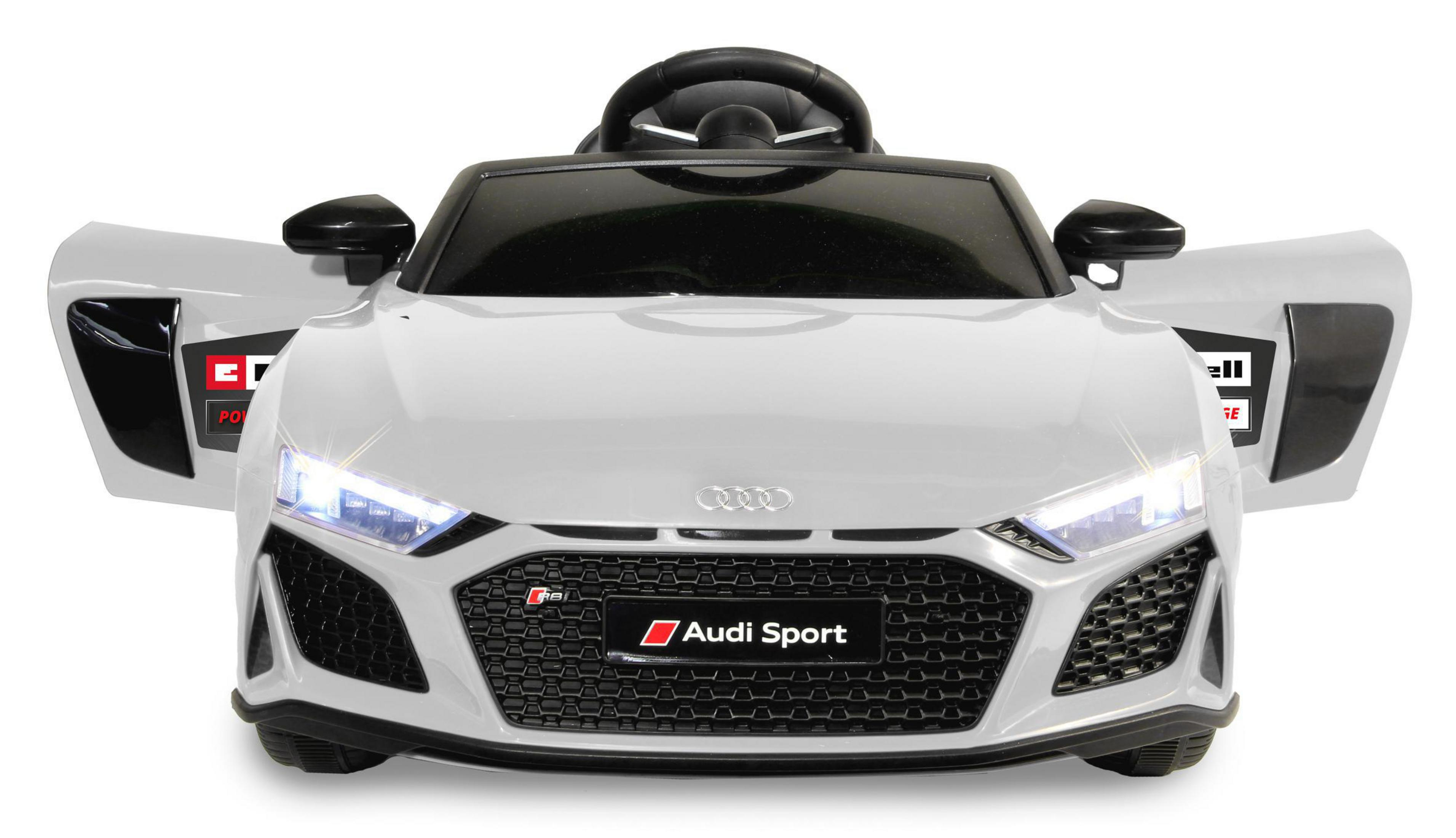 Weißes Audi Sport Spielzeugauto mit geöffneten Türen, Scheinwerfern an, isoliert auf weißem Hintergrund.