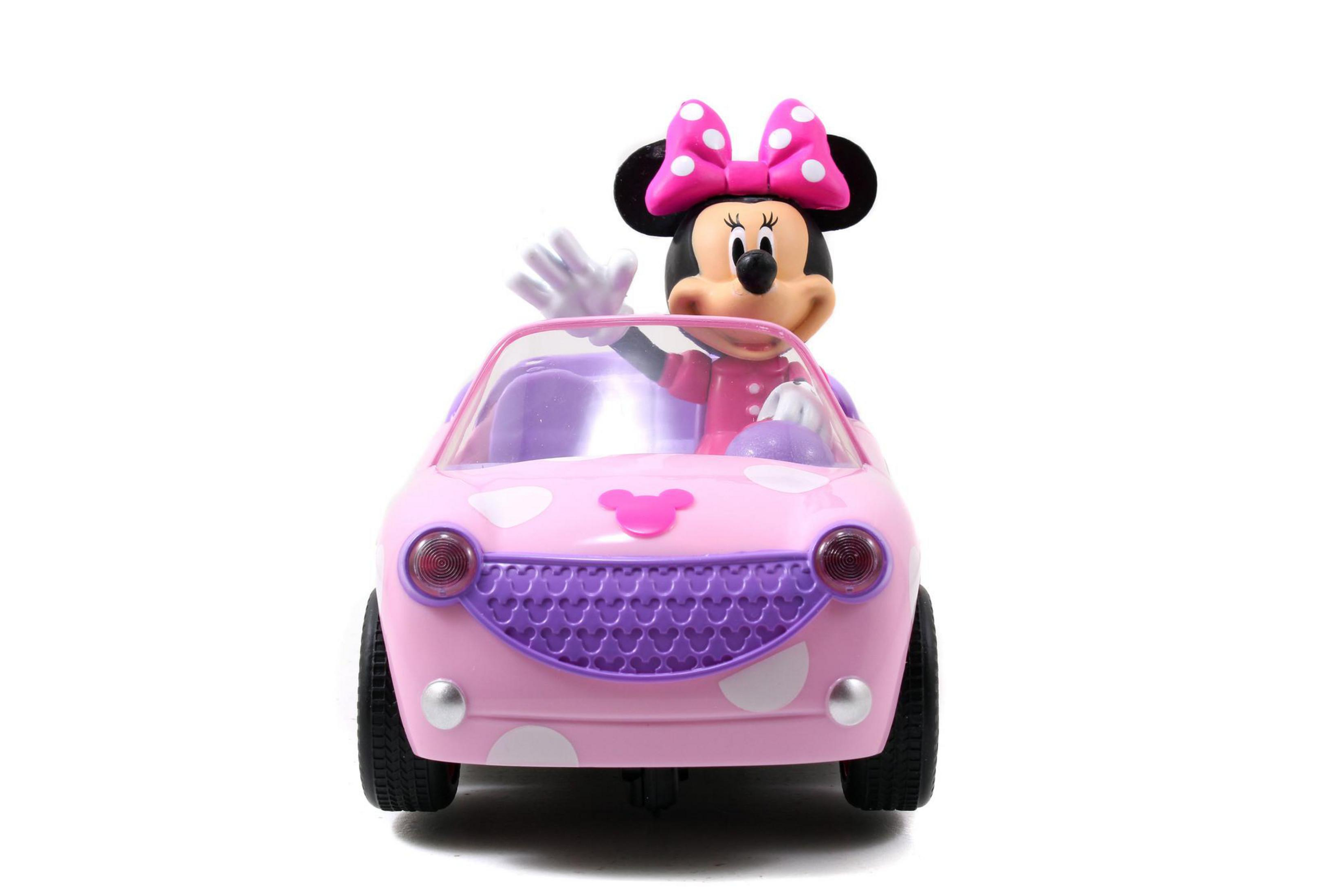 Coche de juguete de Minnie Mouse. Coche rosa, lunares blancos, detalles morados, Minnie saluda.