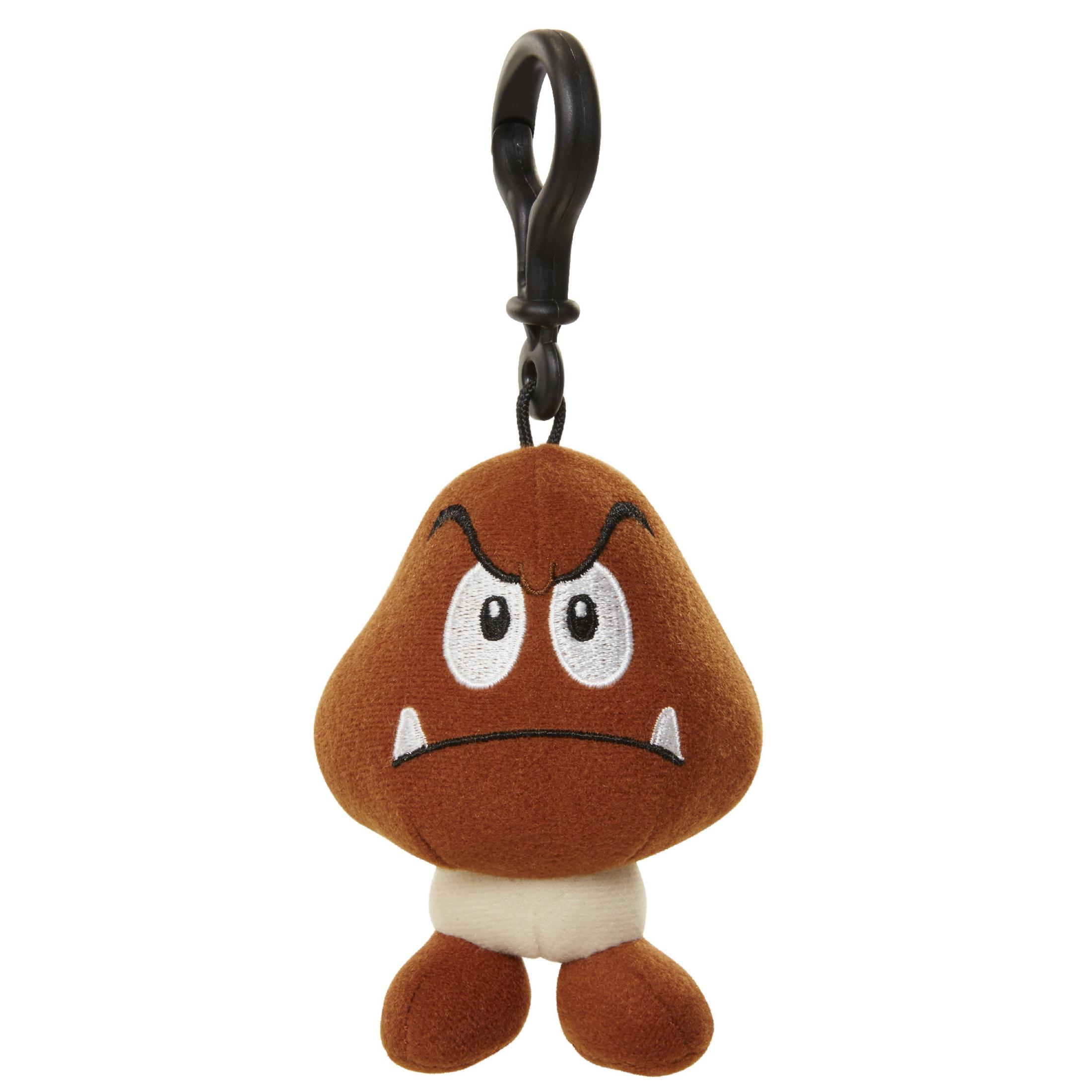 Ein braunes Goomba-Plüschtier mit schwarzem Clip. Weißer Hintergrund.