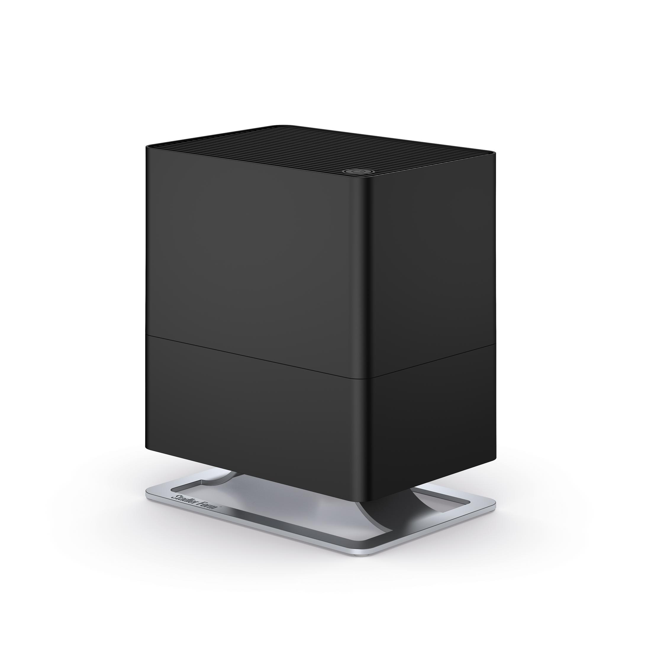 A black humidifier with a rectangular body and a silver base, isolated on a white background.