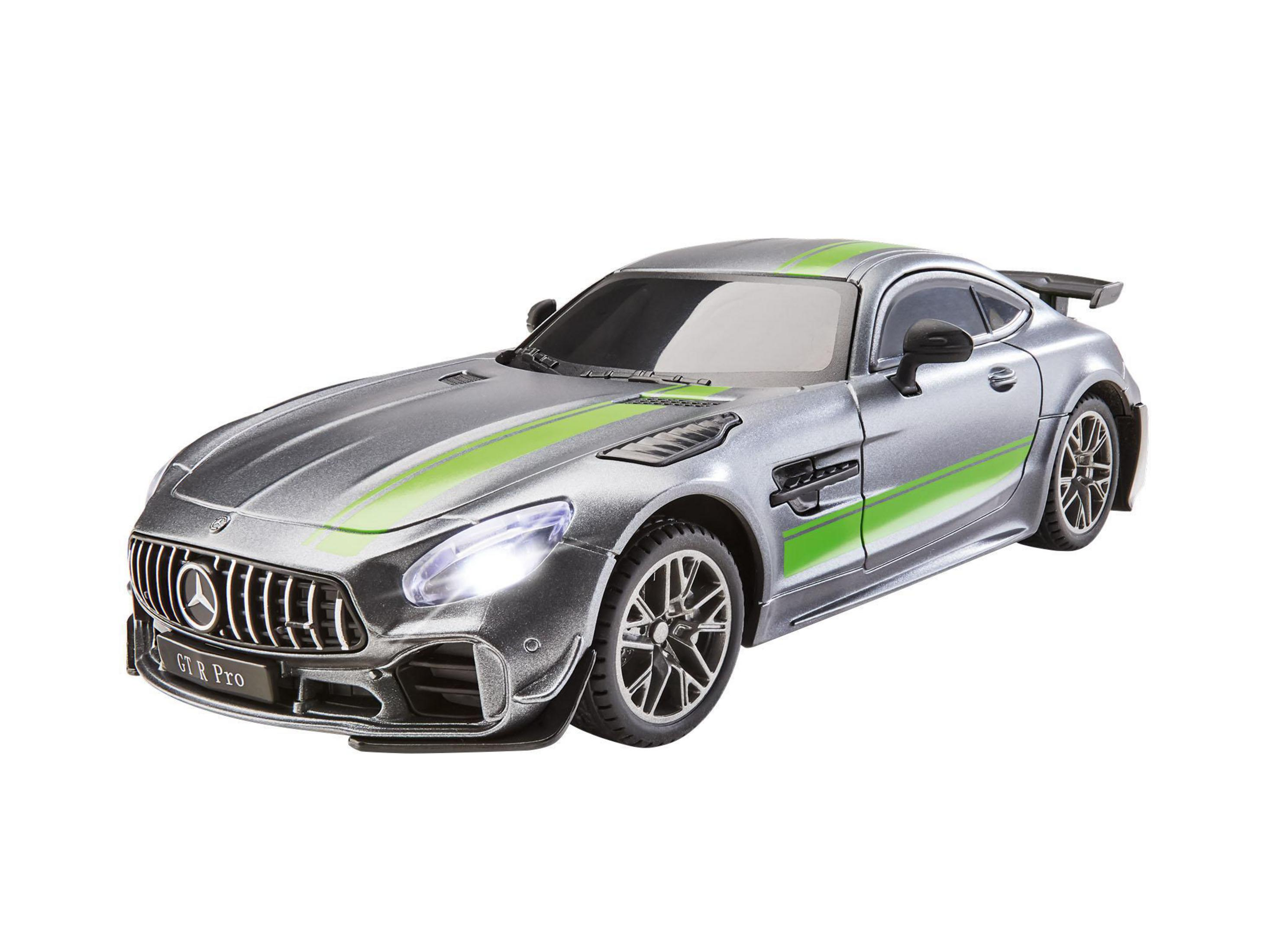 Coche de juguete plateado Mercedes AMG GT Pro con rayas verdes.