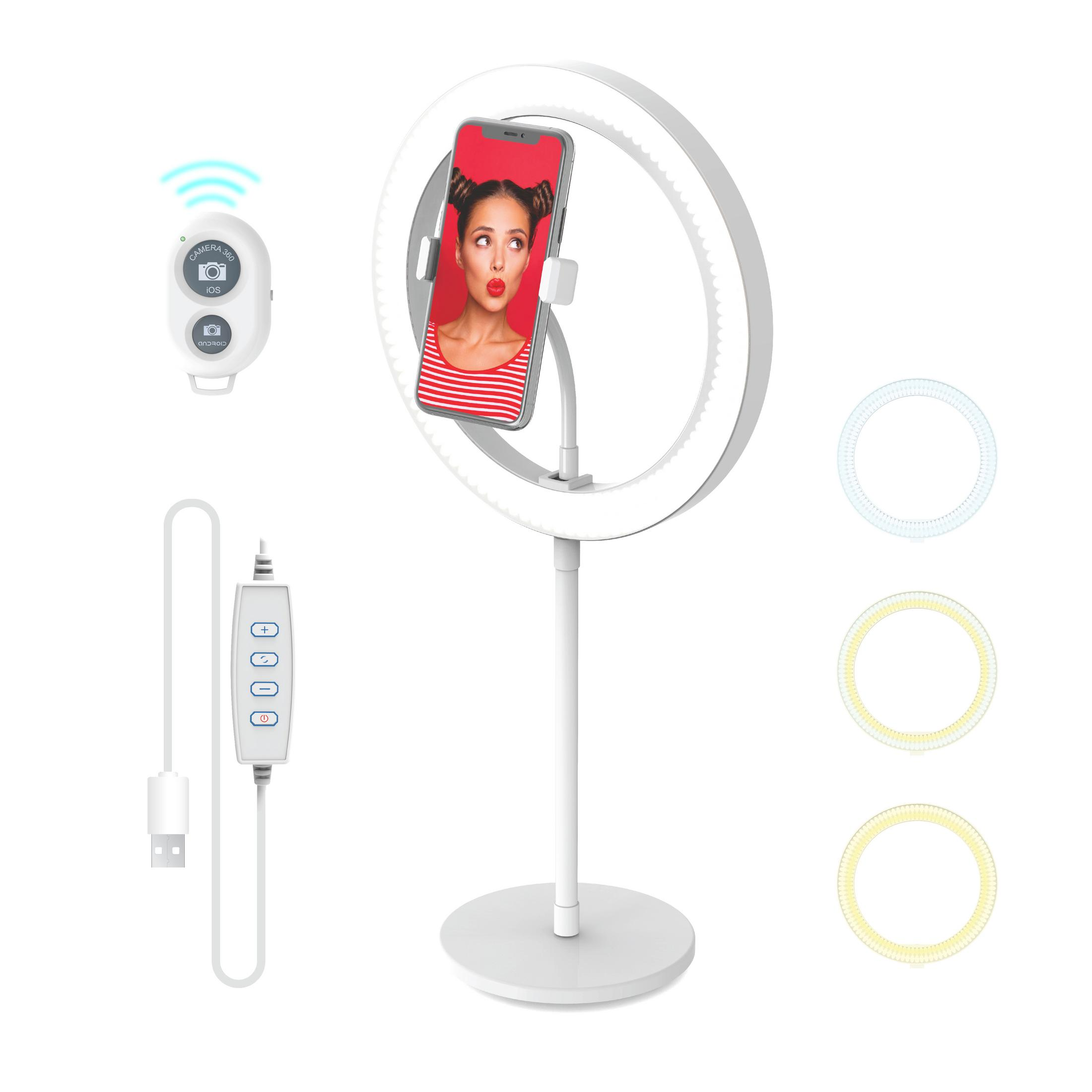 Ringlicht mit Telefon, das eine Frau zeigt. Fernbedienung und drei Lichtfilter sind enthalten.