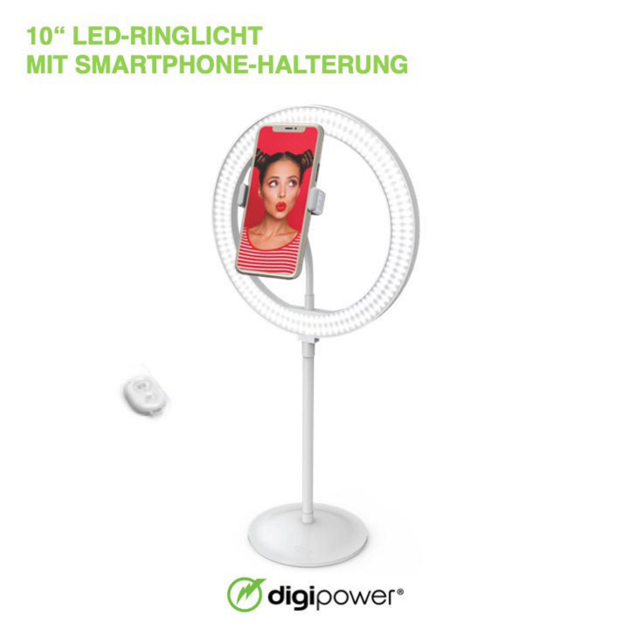 Ein Ringlicht mit Smartphone, für Selfies, auf einem Ständer mit Fernbedienung, auf weißem Hintergrund.