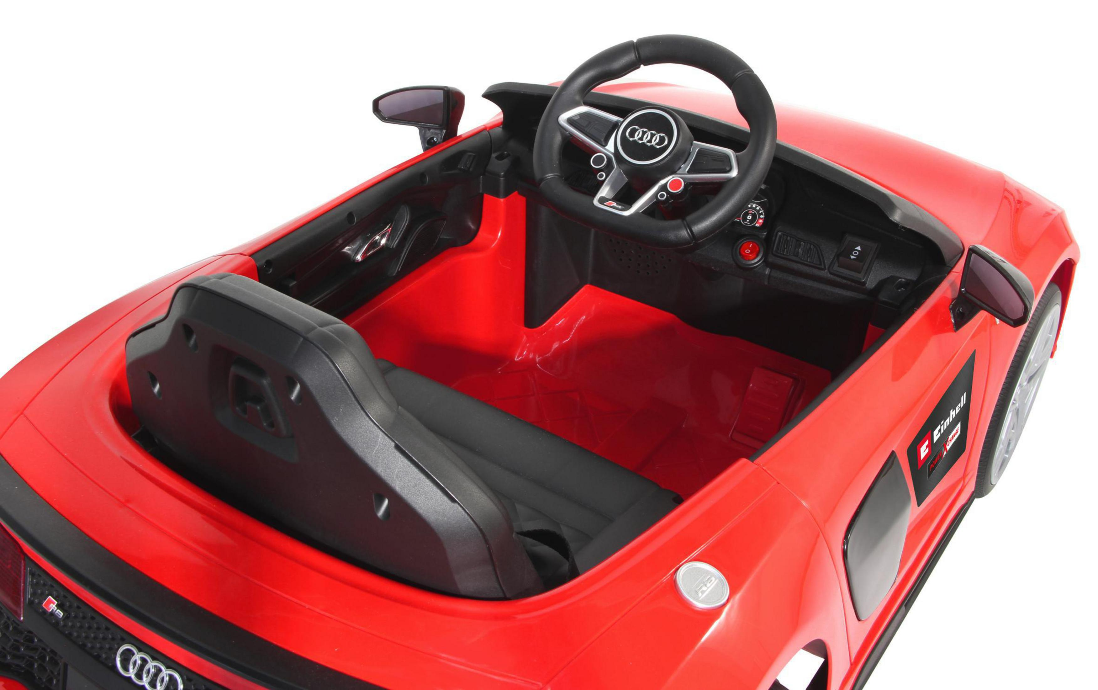 Ein rotes Spielzeugauto mit offenen Türen, Lenkrad und Sitzen.