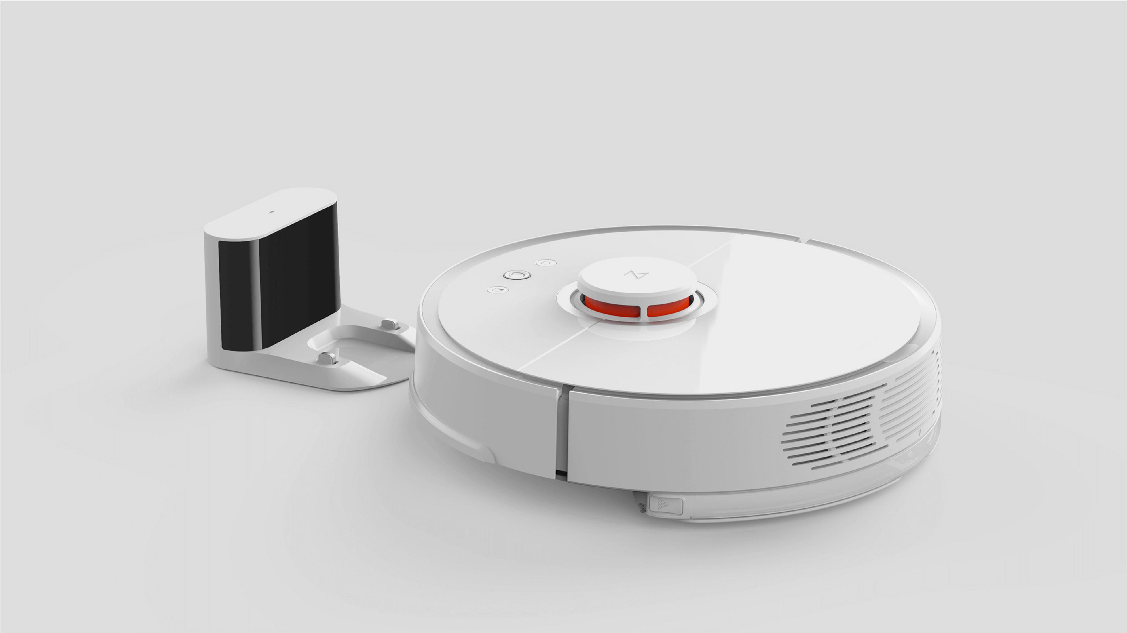 Weißer Roboter-Staubsauger und Ladestation. Der Staubsauger hat einen roten Knopf und Sensor.