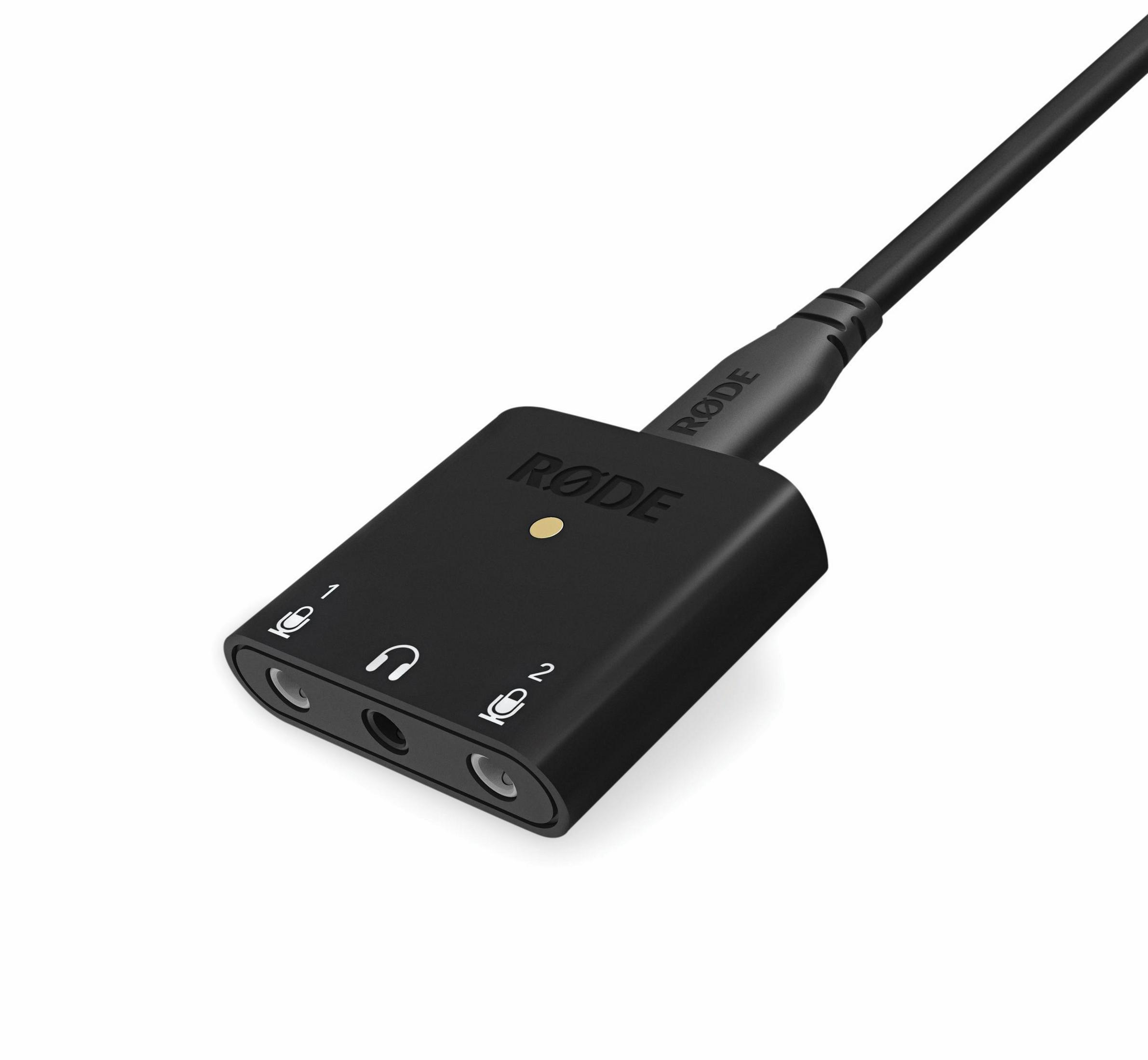Zwarte audio-interface met koptelefoon- en microfooningangen, witte achtergrond.