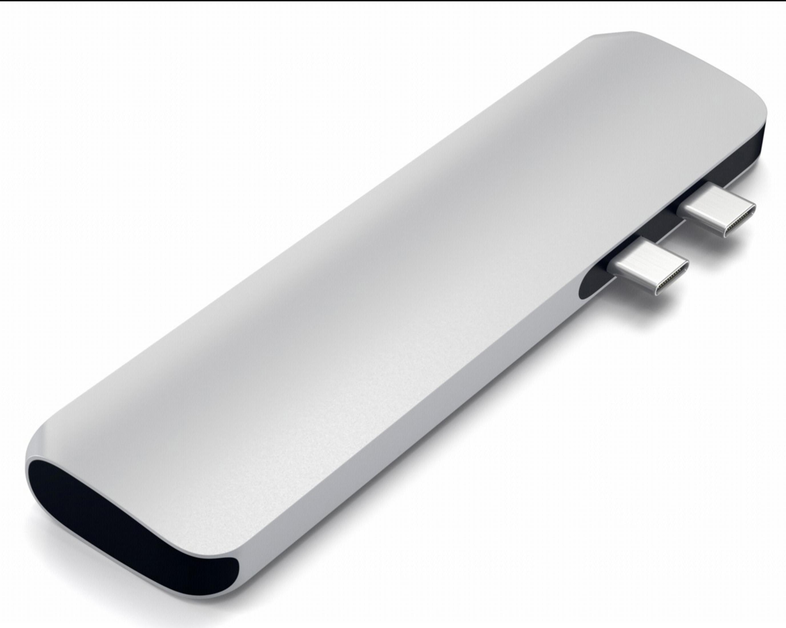 Silver USB-C hub with two USB-C ports, on a white background.