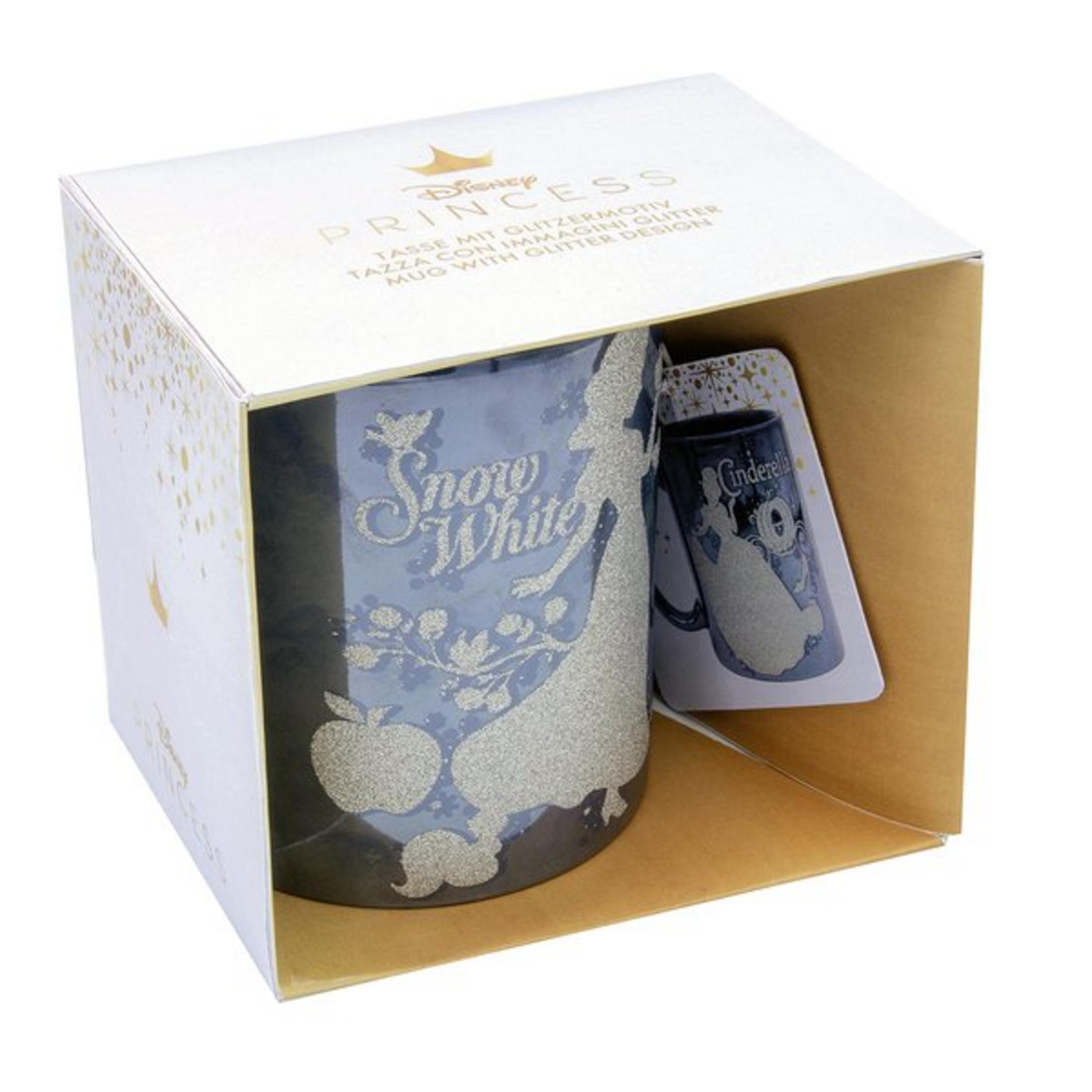 Tasse in einer Box. Die Tasse hat eine Schneewittchen-Silhouette. Die Box zeigt auch eine Aschenputtel-Tasse.