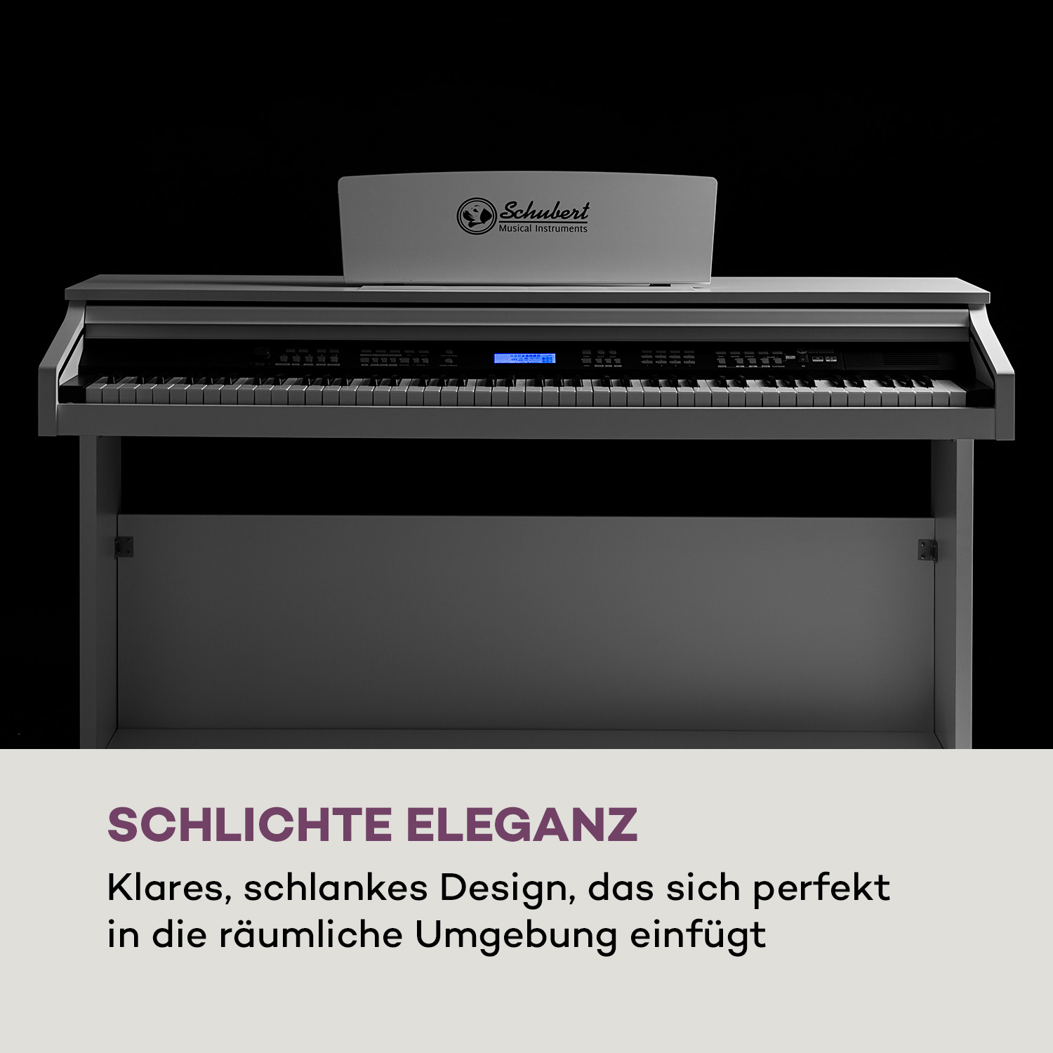 Graues Digitalpiano mit Schubert-Logo, vor schwarzem Hintergrund.