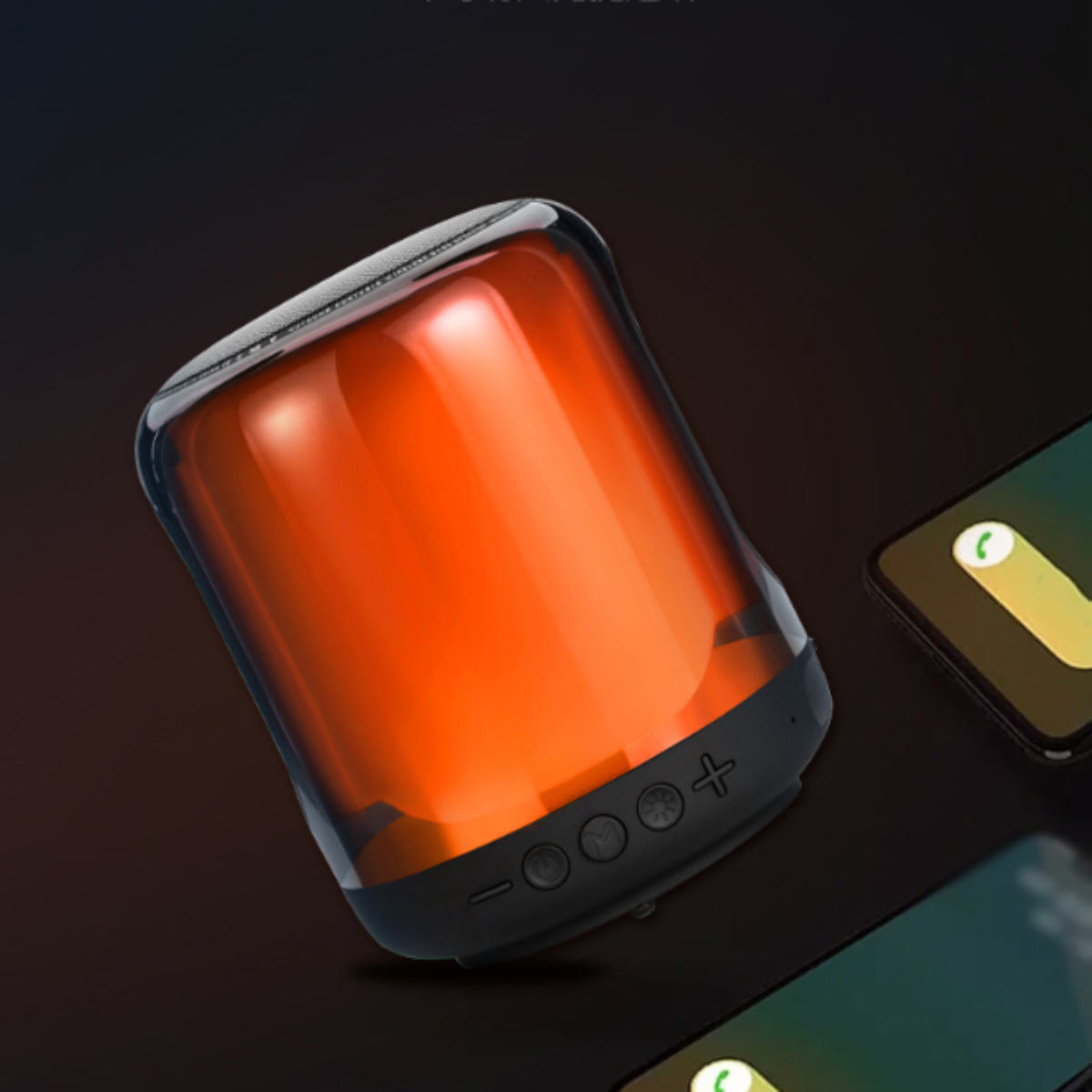 Leuchtender orangefarbener Lautsprecher mit schwarzen Knöpfen und zwei Telefonen.