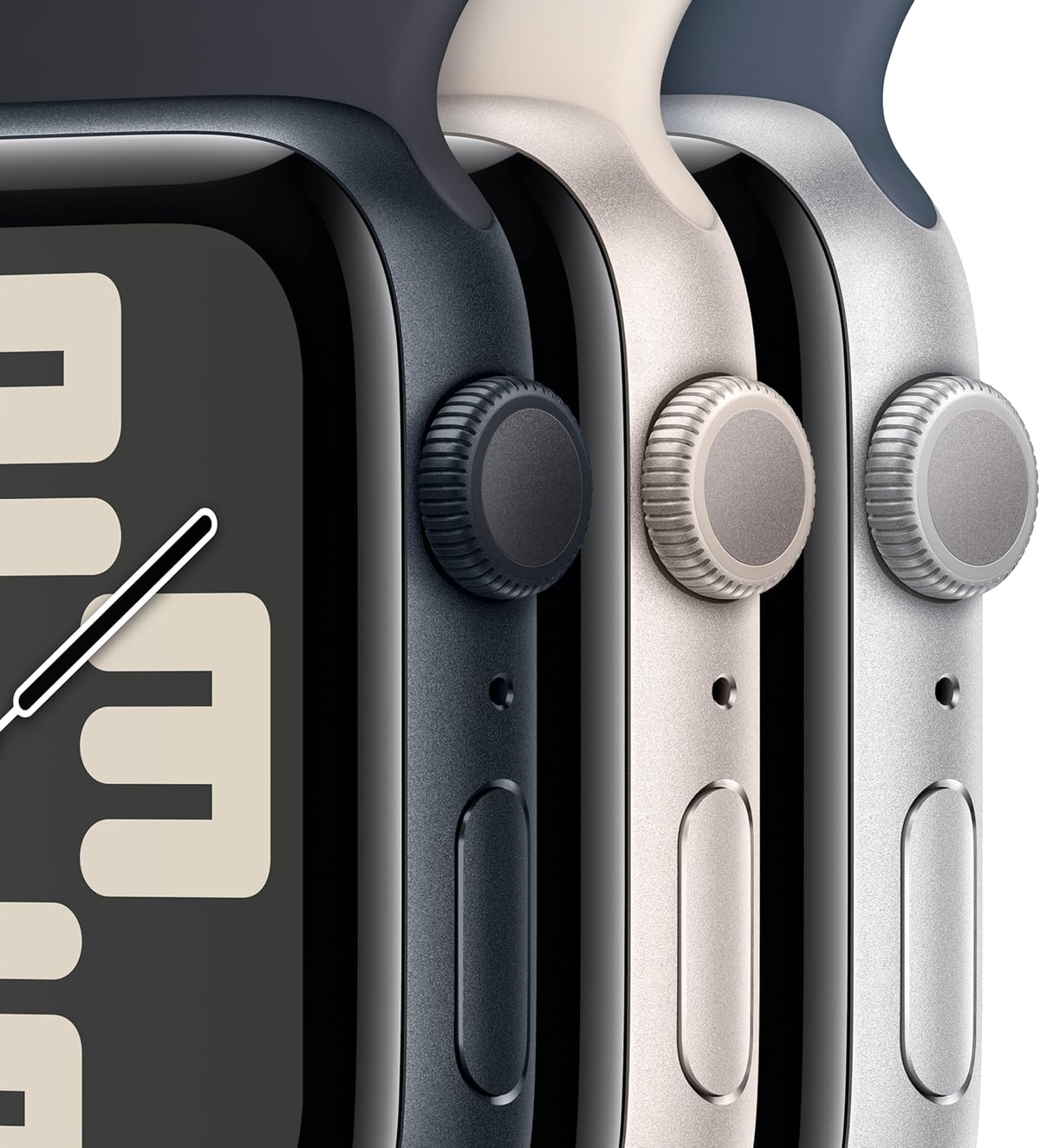 Close-up of three smartwatches. They are black, beige, and silver, with a button on the side.