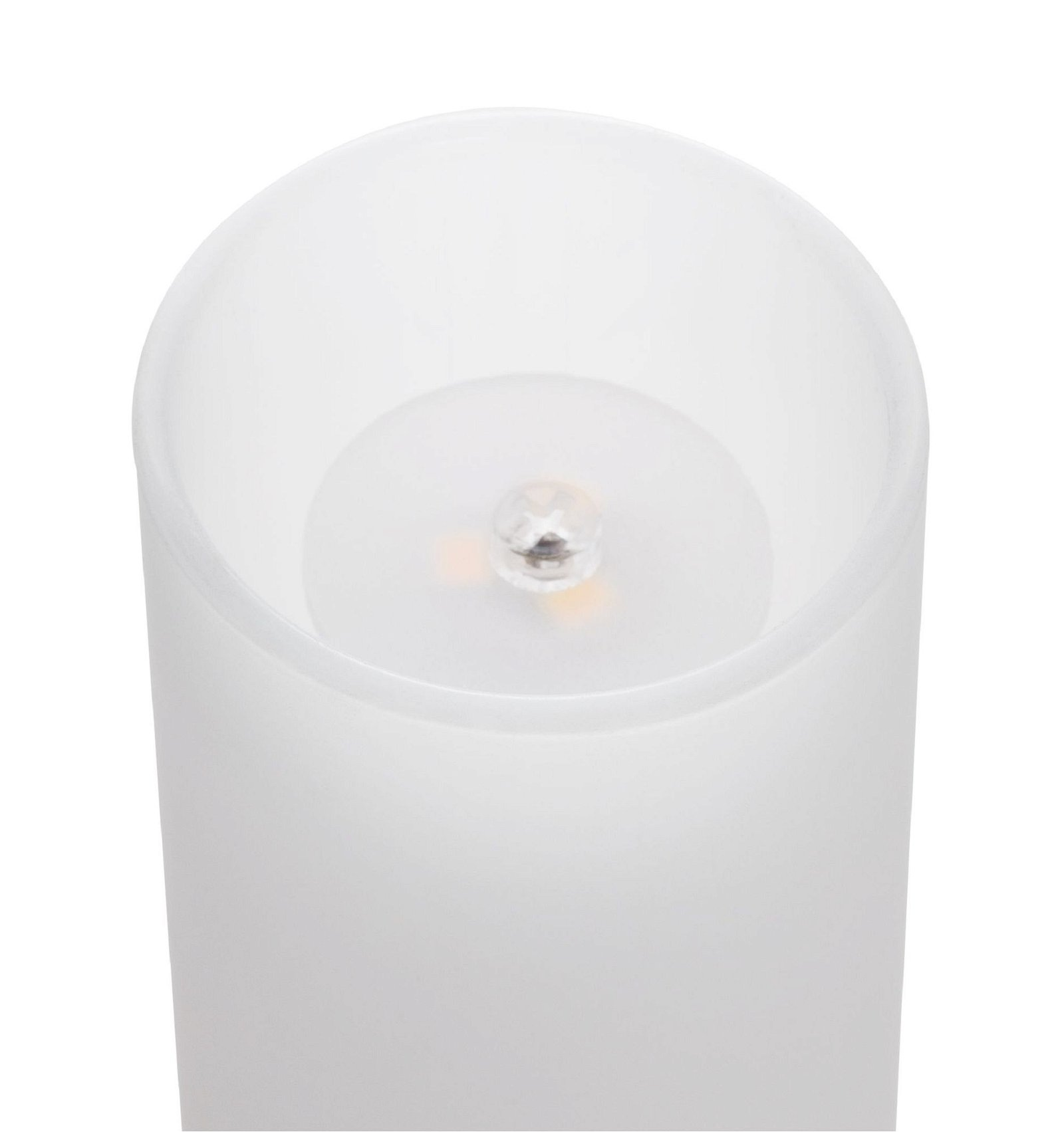 Biała świeca ze źródłem światła w środku.