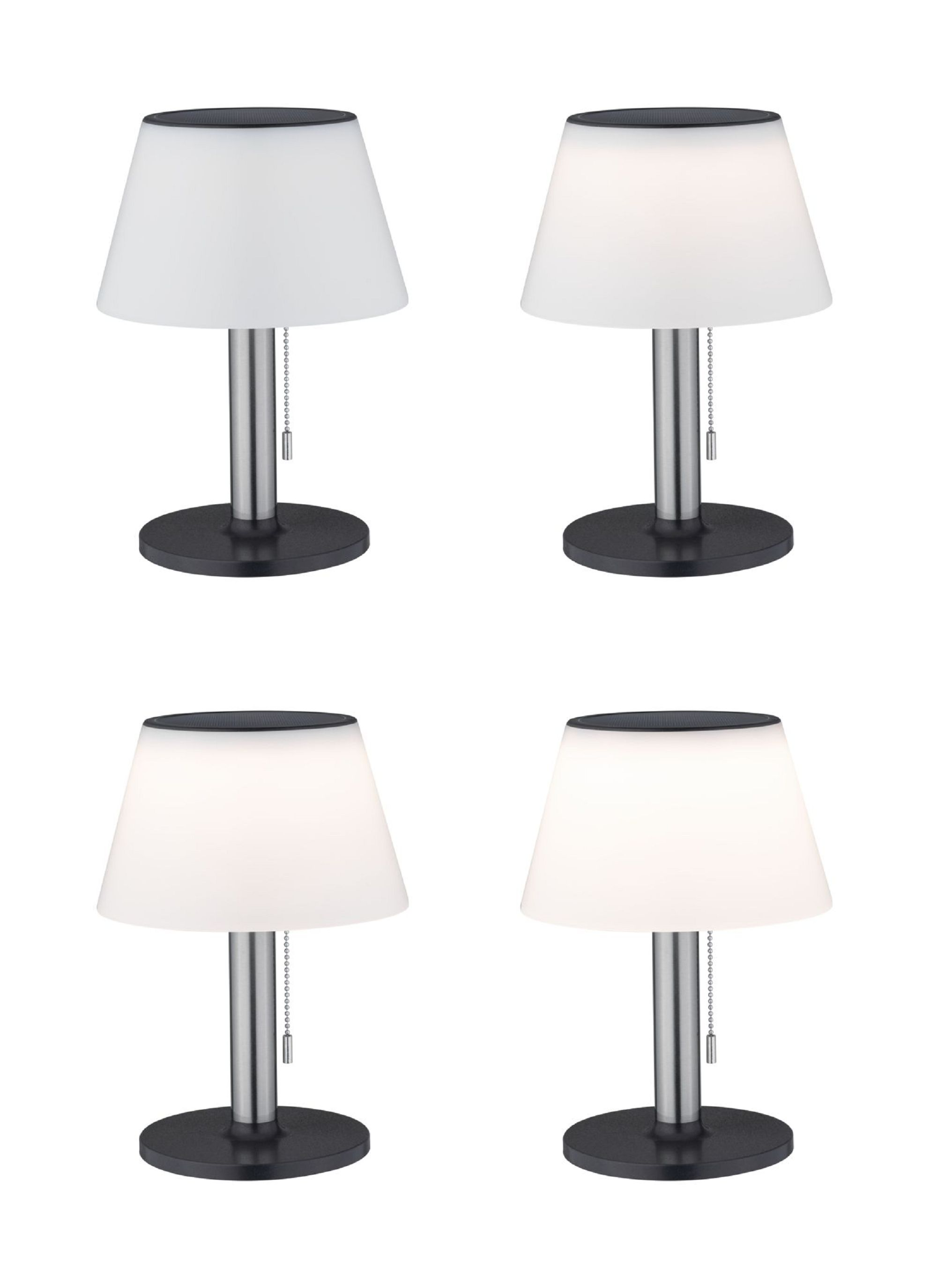 Cztery lampy stołowe z białymi kloszami i czarnymi podstawami, każda zapalona, na białym tle.