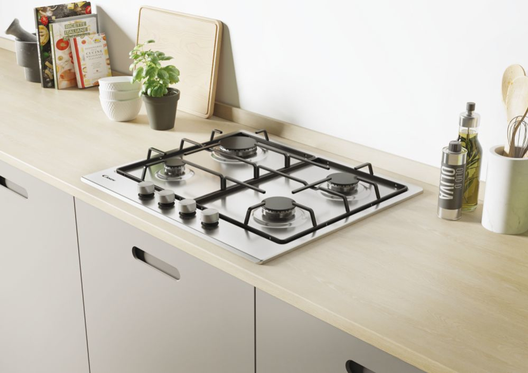 Płyta kuchenna na drewnianym blacie z szafkami, deską do krojenia i przyborami kuchennymi.