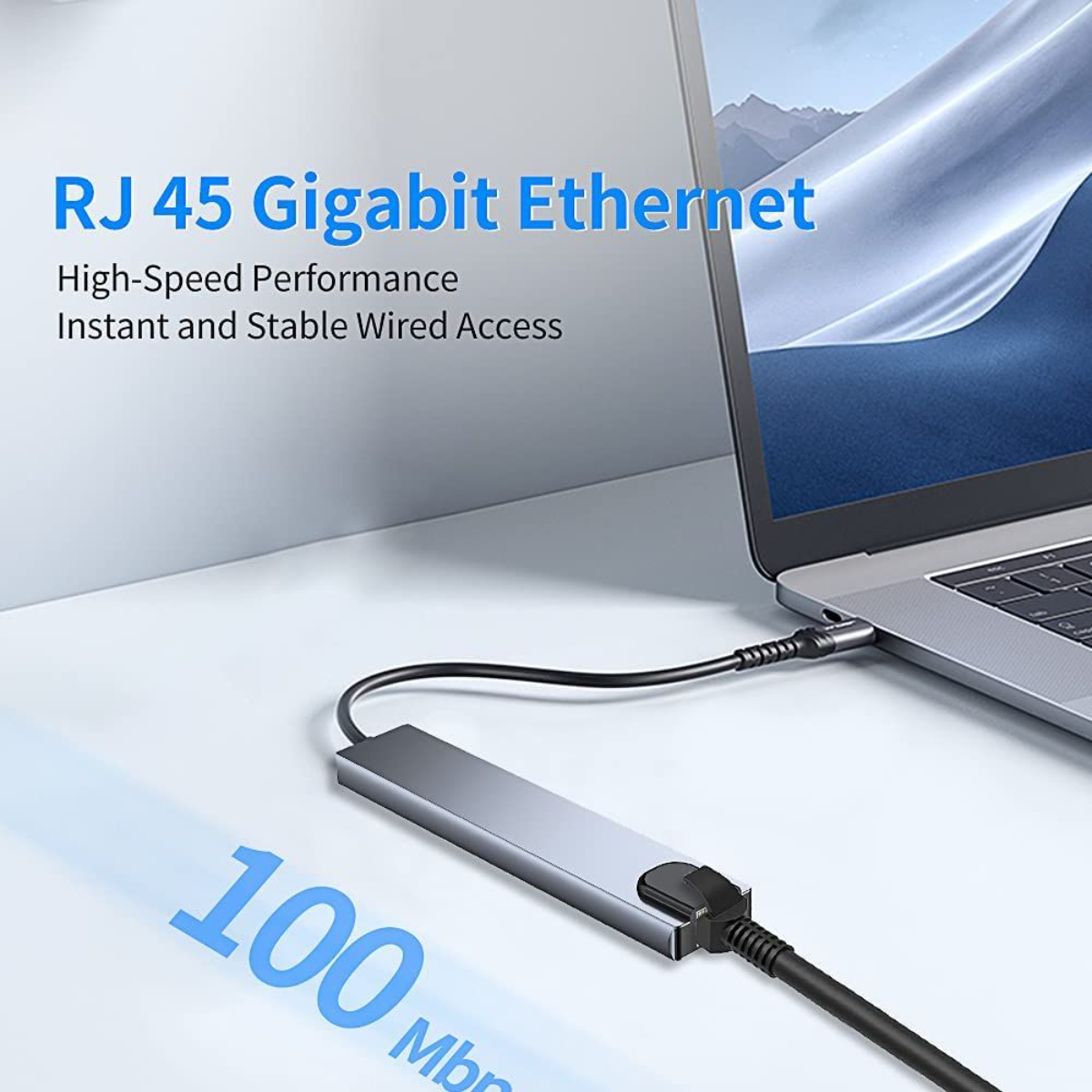 Portátil conectado a un adaptador Ethernet Gigabit RJ45 plateado. Superposición de texto describe funciones.