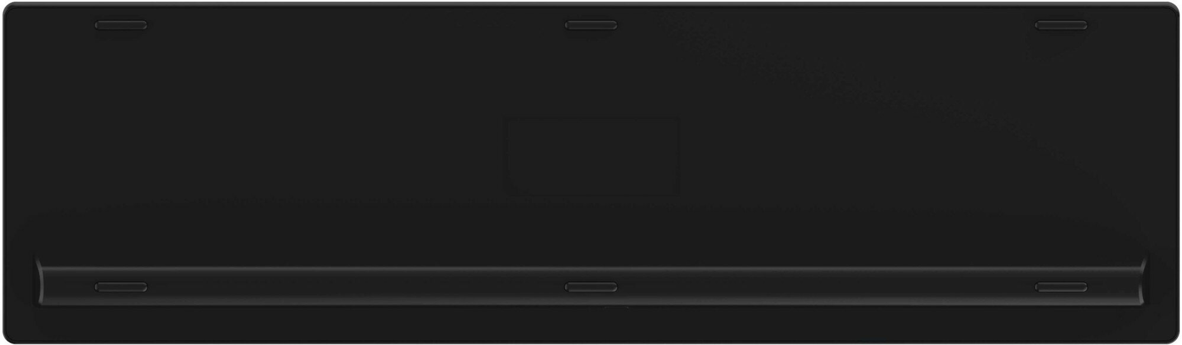 Tył czarnej klawiatury. Pokazuje spód i nóżki.